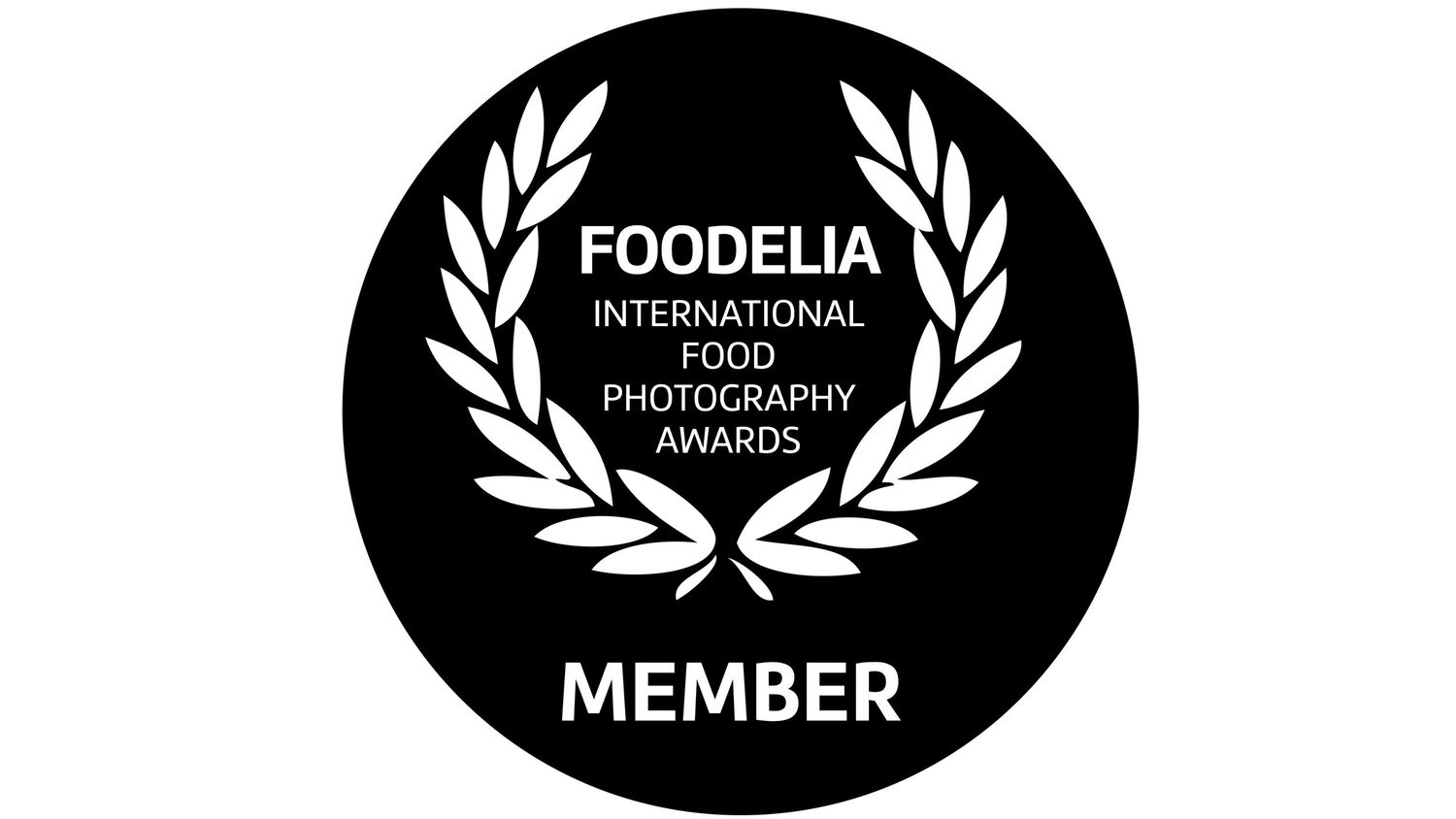 Row of black circular food photography award badges with laurel wreaths.