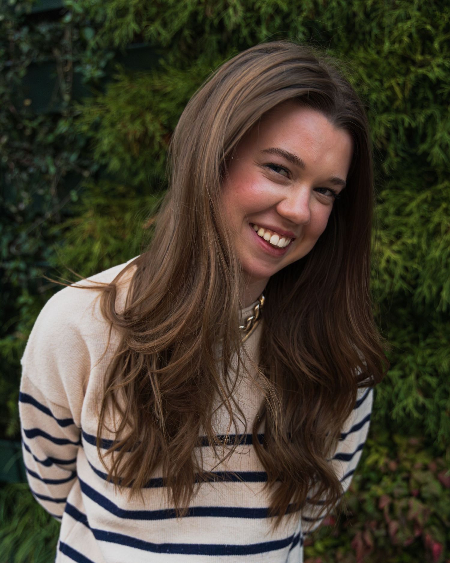 A girl smiling.