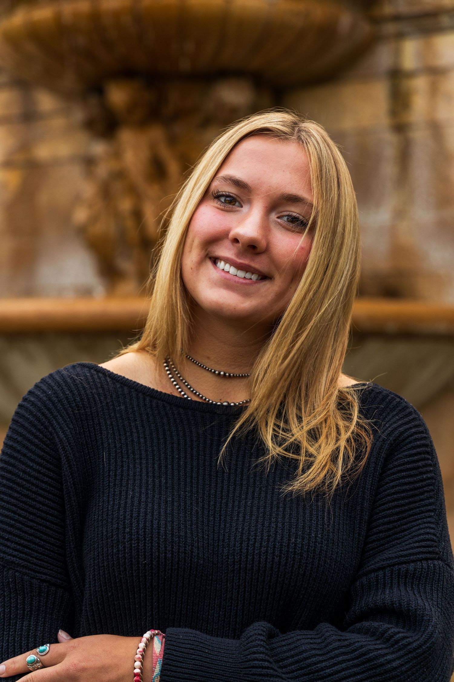 A girl smiling.