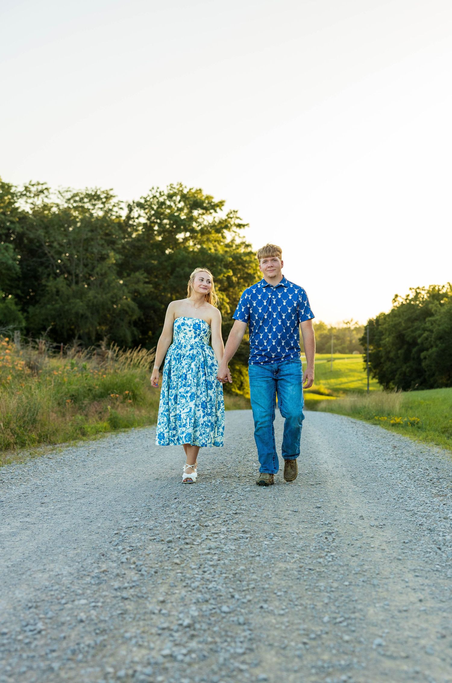 A couple walking down a road.