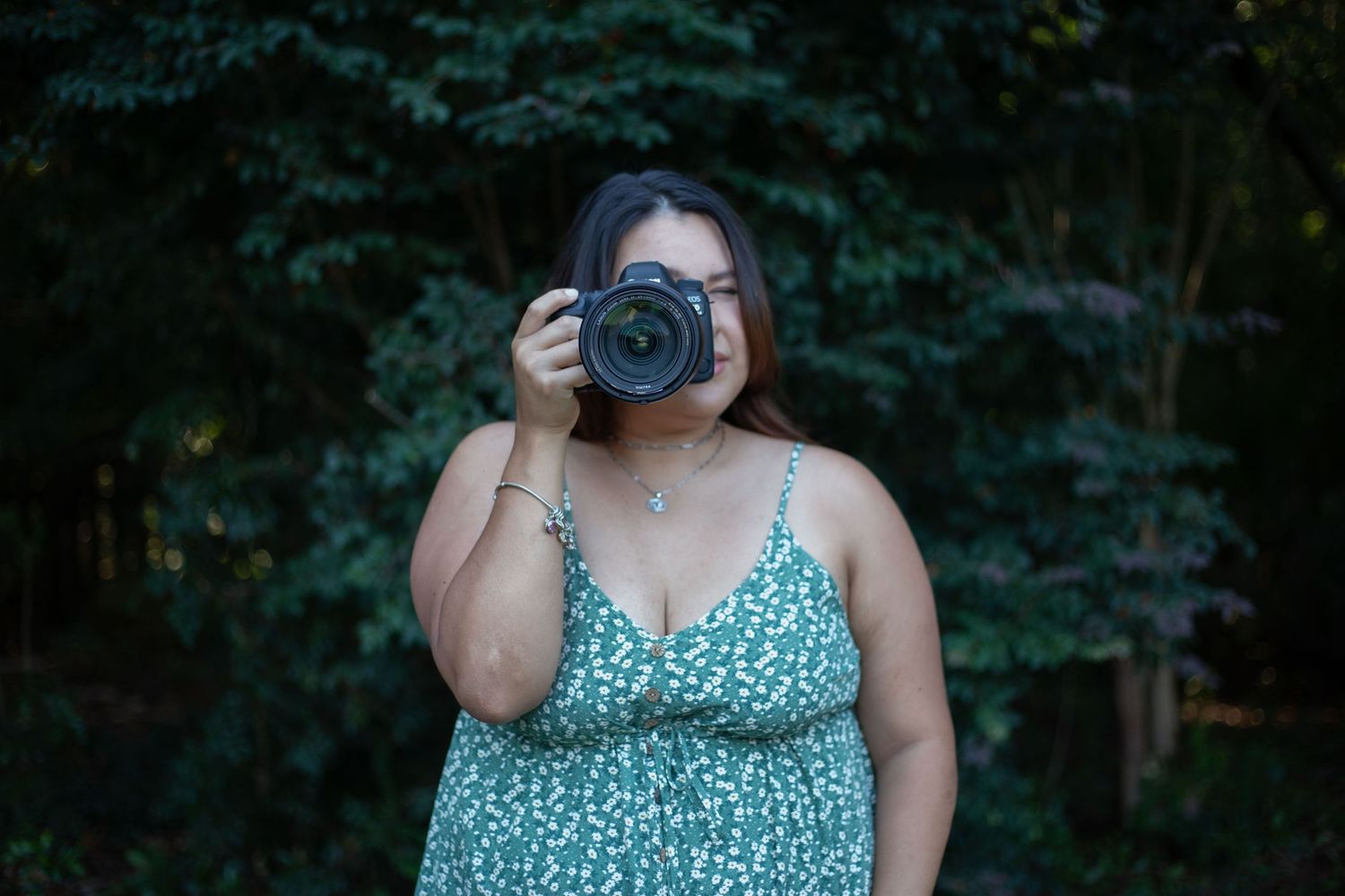 portrait of photographer looking through camera view finder