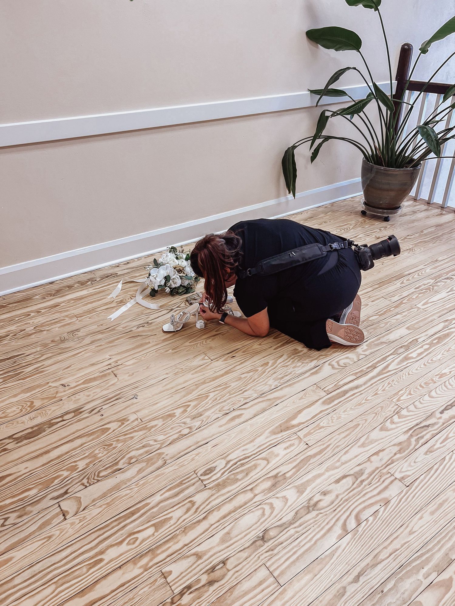 photographer styling a wedding flat lay