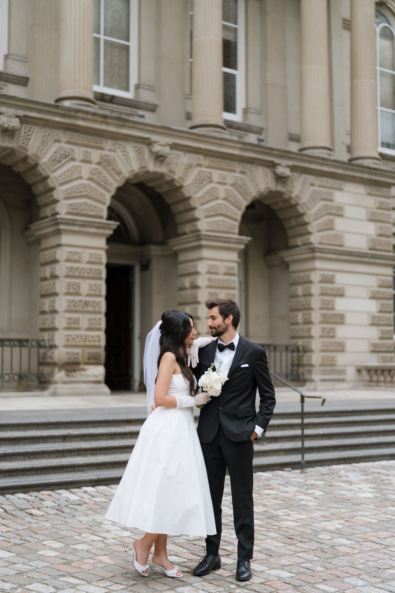 A bride and groom share a romantic moment outside Osgood hall building captured by AZ photo studio.