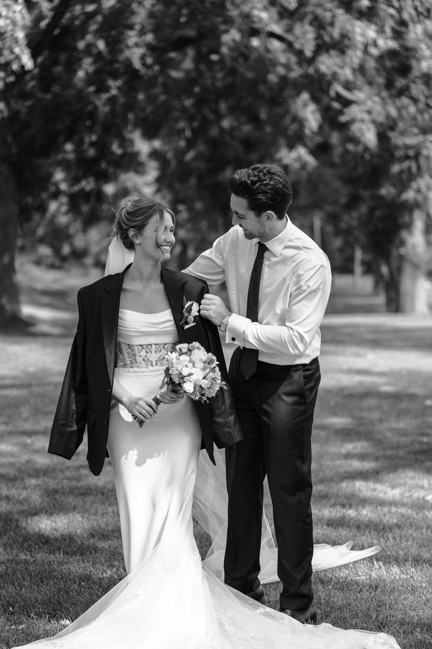 Black and white sequence of a romantic wedding moment showing playful interactions between a couple in formal attire outdoors.