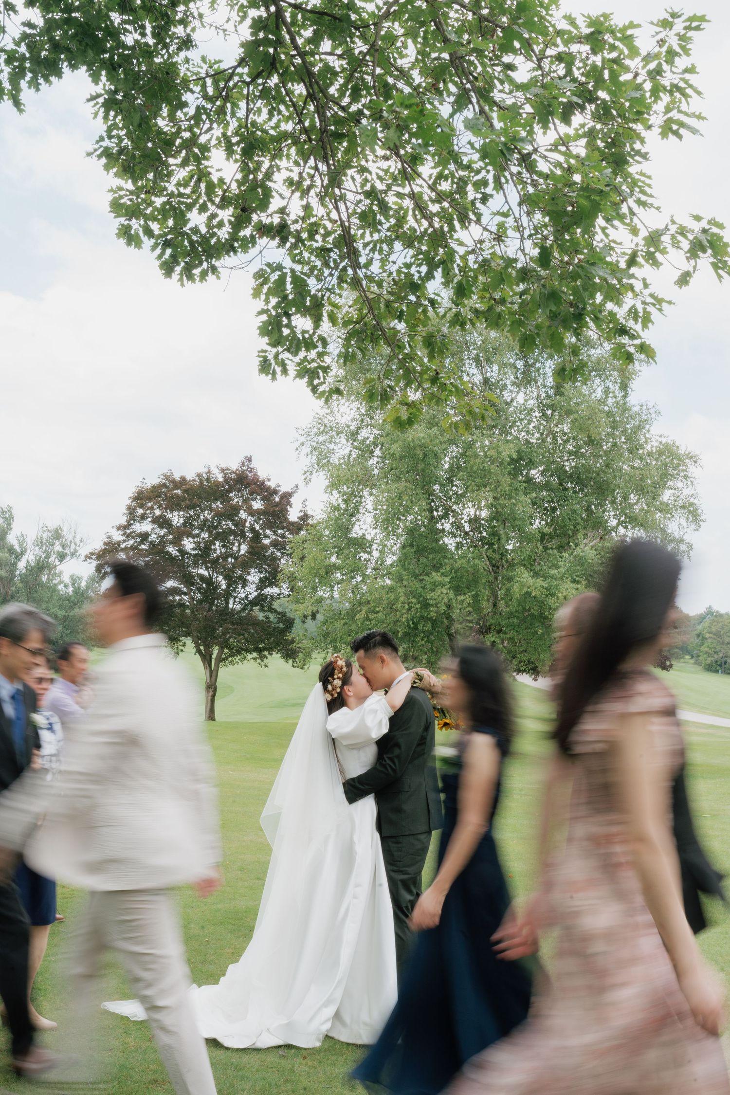 Artistic vision shot of the bride, groom, and bridal party at Pheasant Run Golf Club, captured by AZ Photo Studio.