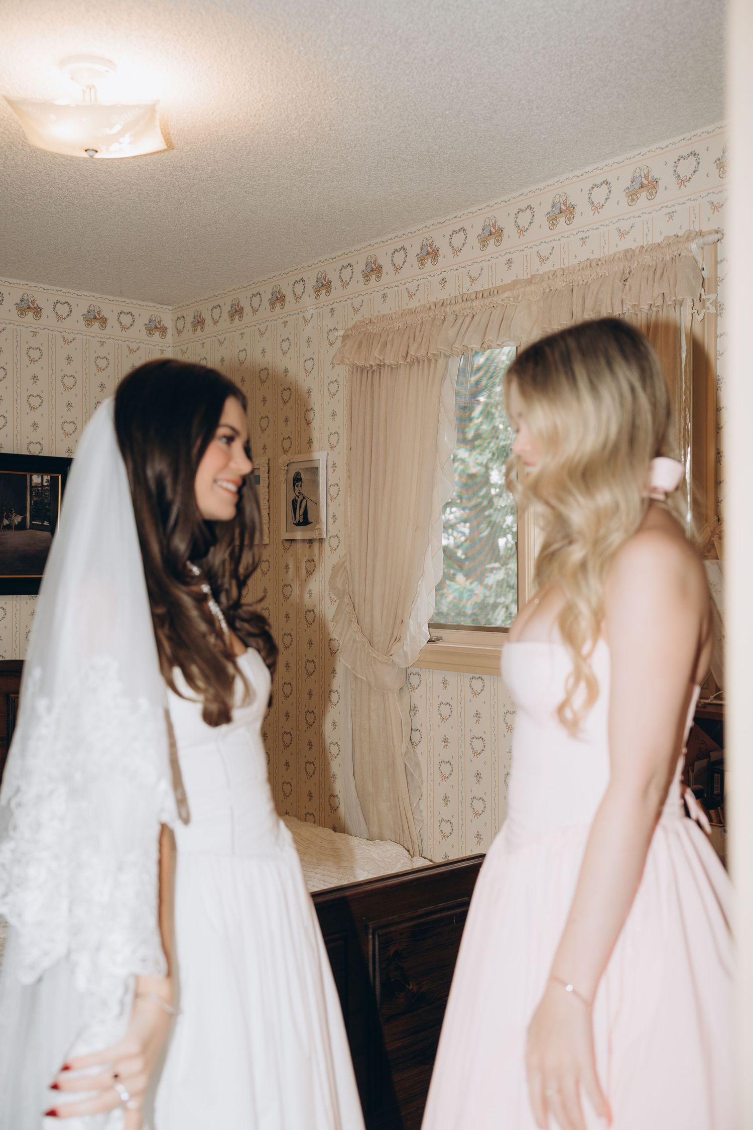 Several film frames show a bridal gown fitting session in a room with floral wallpaper and cream colored curtains.