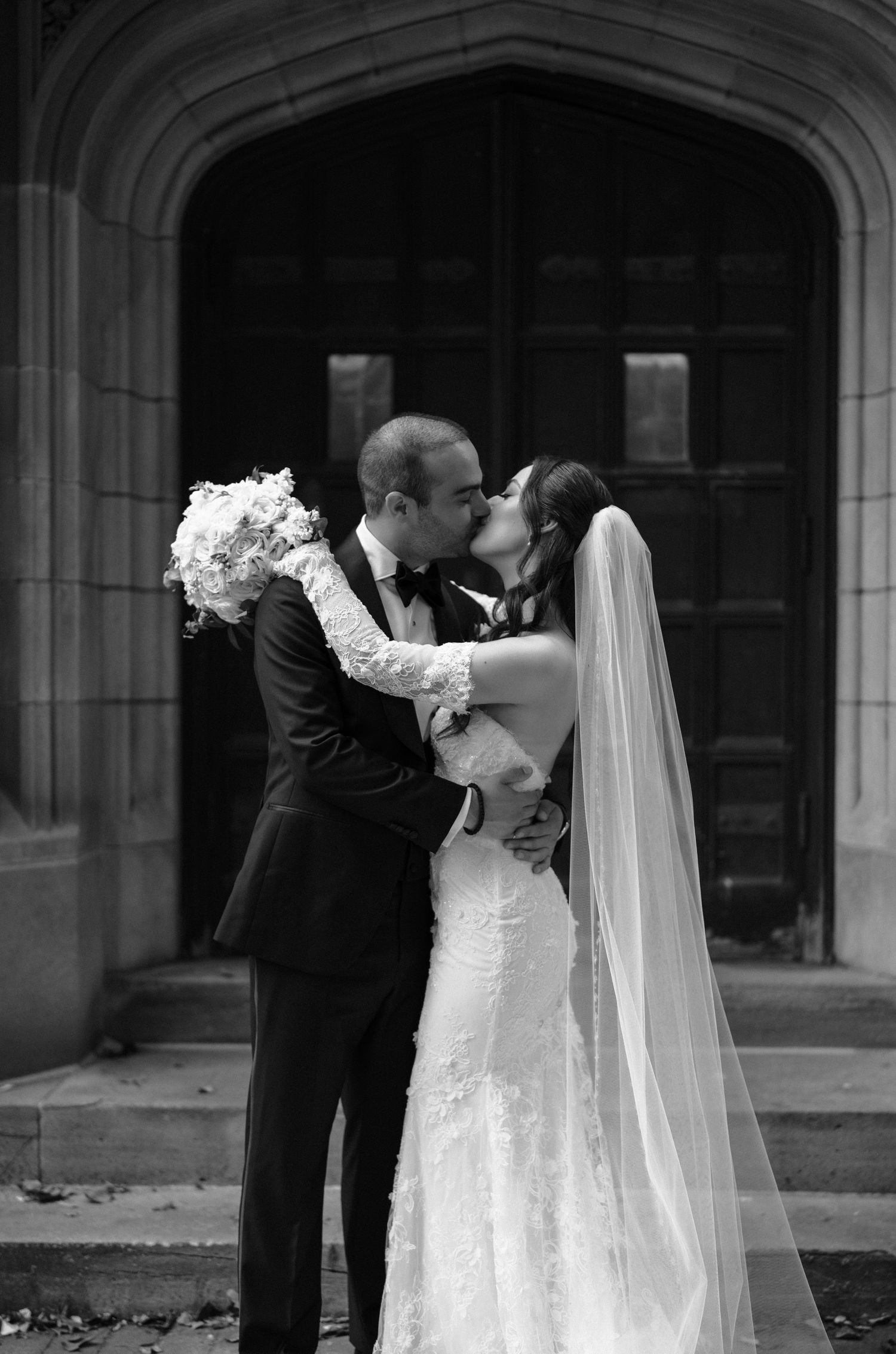 Romantic black and white wedding photo series showing intimate moments between newlyweds.