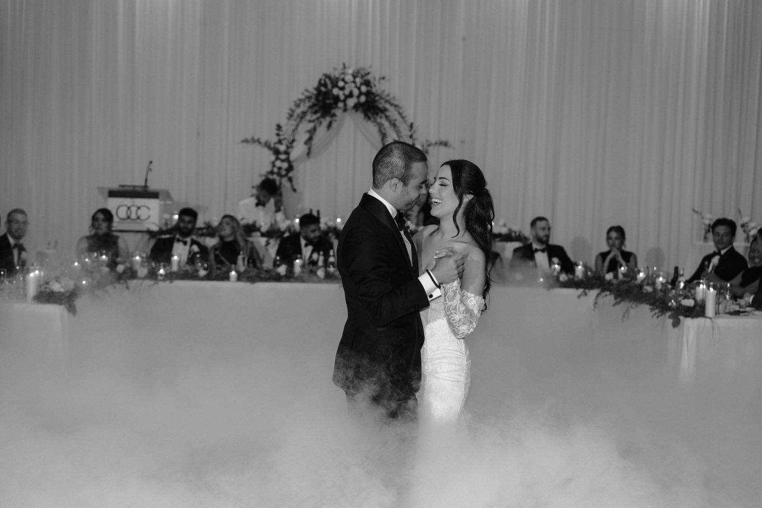 A sequence of black and white photos showing a couple's first dance at their wedding reception.