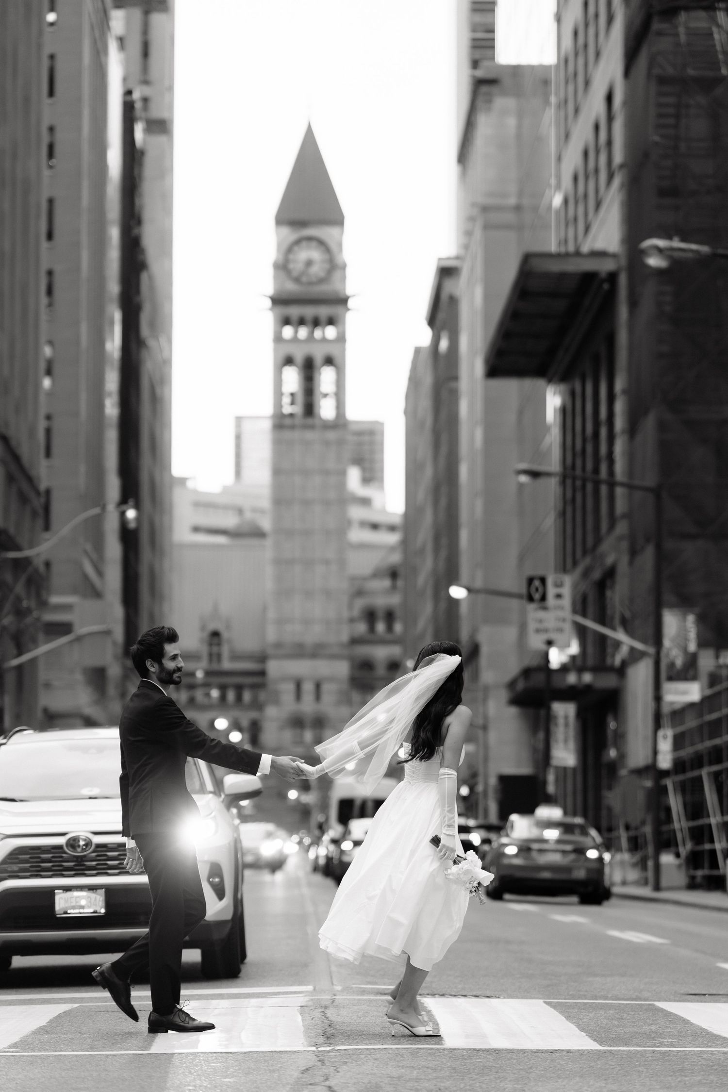 Black and white Documentary-style candid street photoshoot in Toronto with City Hall in background by AZ Photo Studio