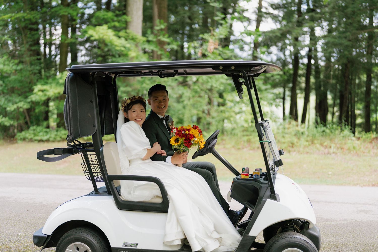 Bride and groom driving a golf cart at Pheasant Run Golf Club, AZ Photo Studio photography.