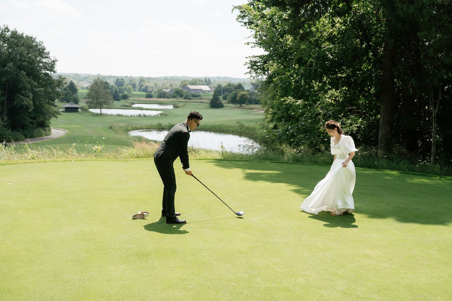 Bride and groom playing golf together at Pheasant Run Golf Club, fun wedding photography by AZ Photo Studio.