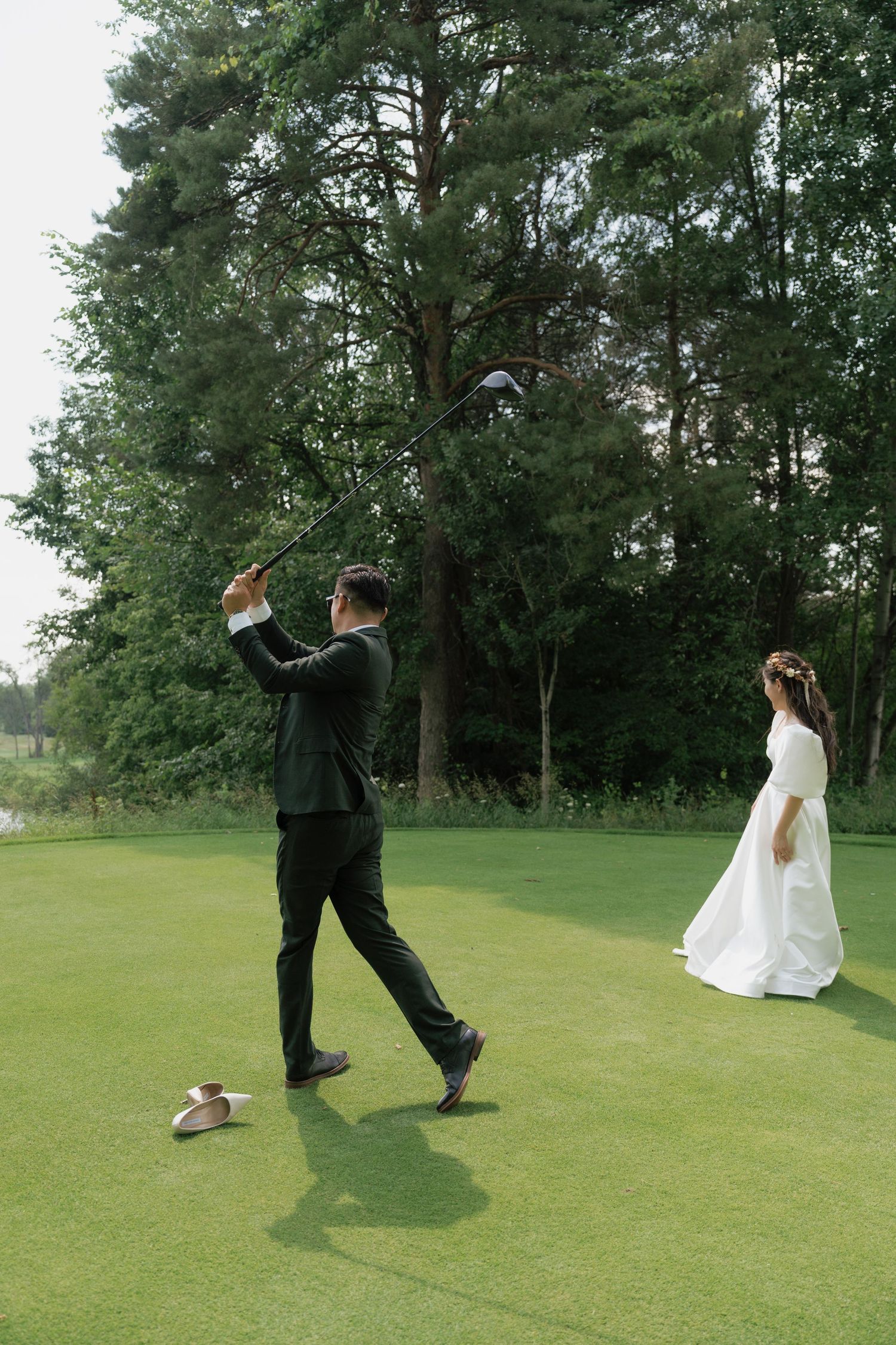 Bride and groom playing golf together at Pheasant Run Golf Club, fun wedding photography by AZ Photo Studio. cinematic shot