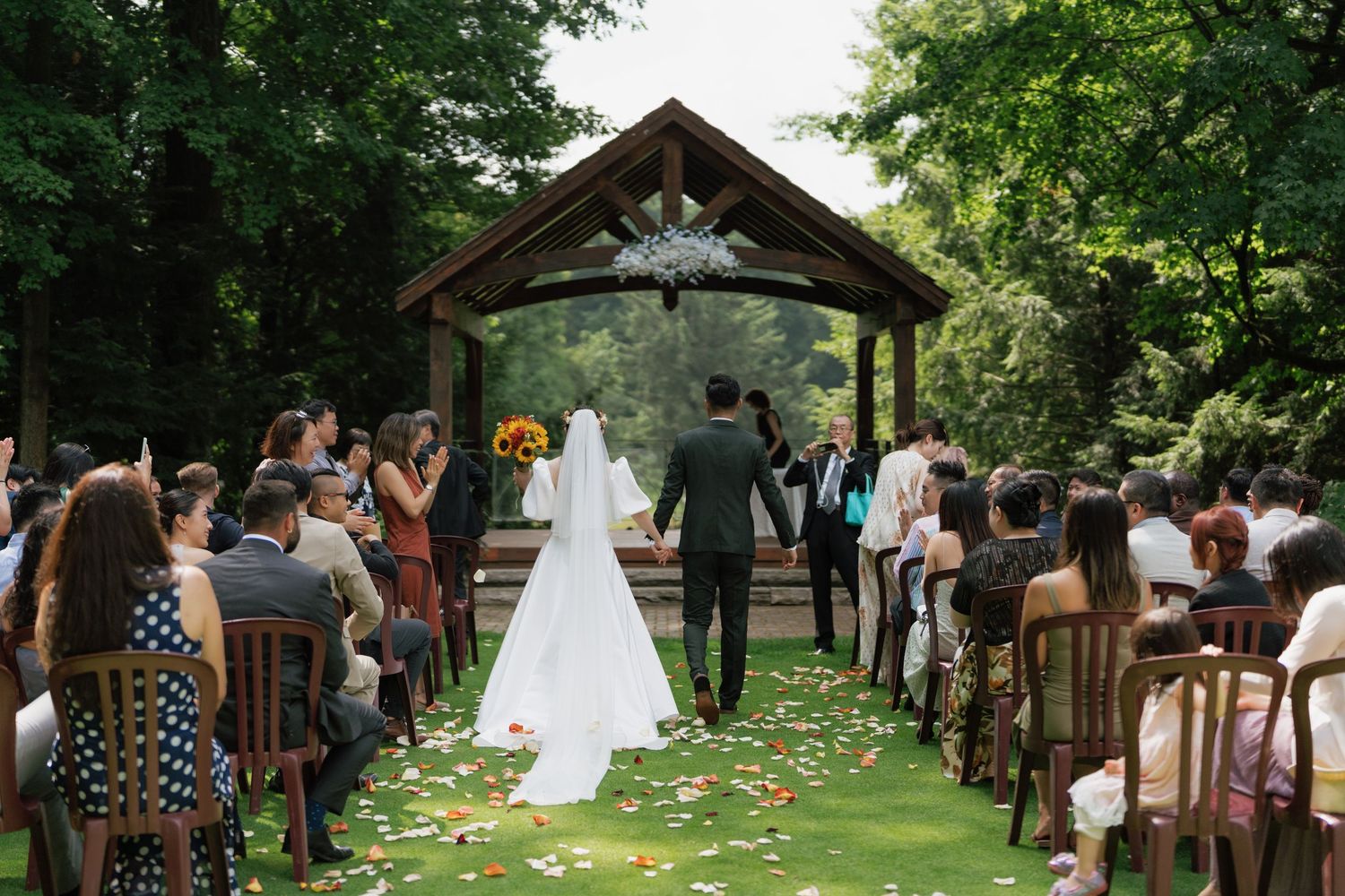 Walking down the aisle outdoor ceremony captured by AZ Photo Studio
