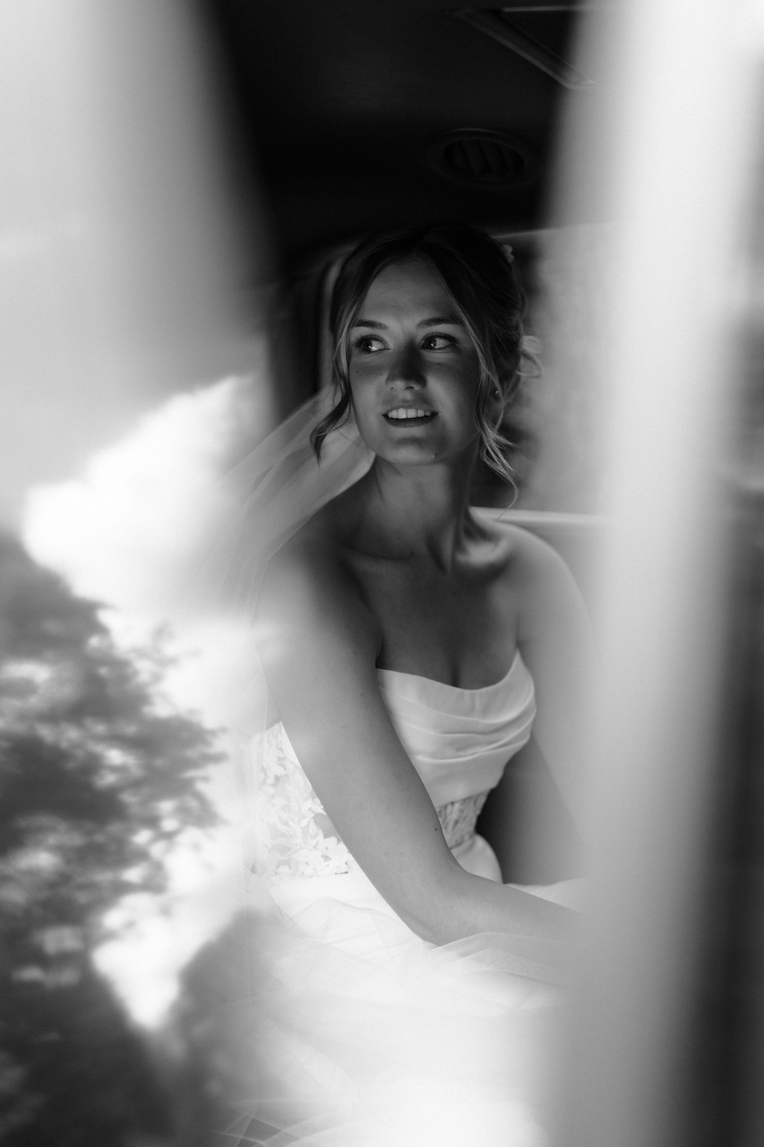 A dreamy black and white portrait series showing a figure in white against a cloudy sky background.