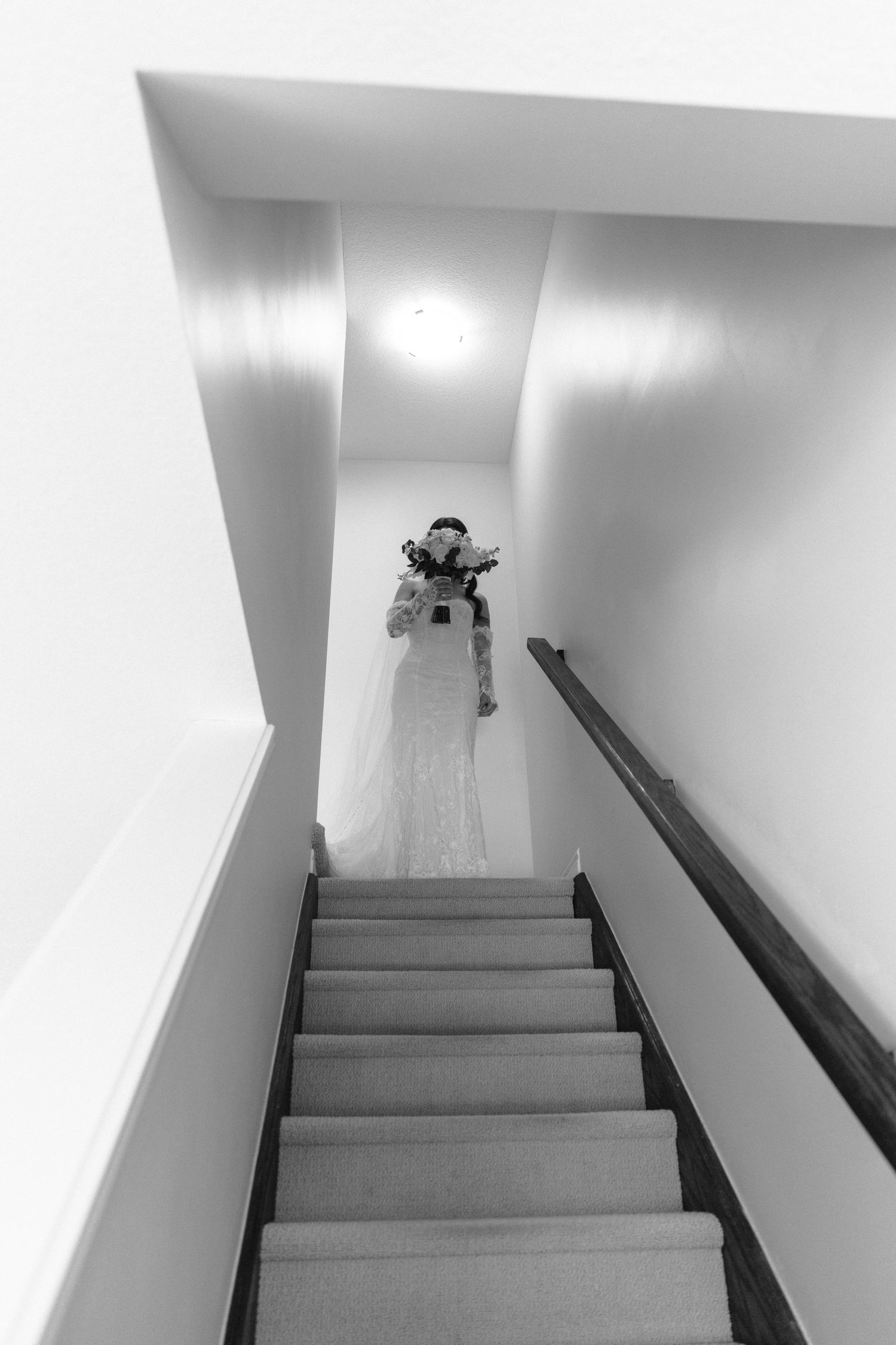 A series of black and white photos showing a staircase with a mysterious shadow at the top creating an eerie atmosphere.
