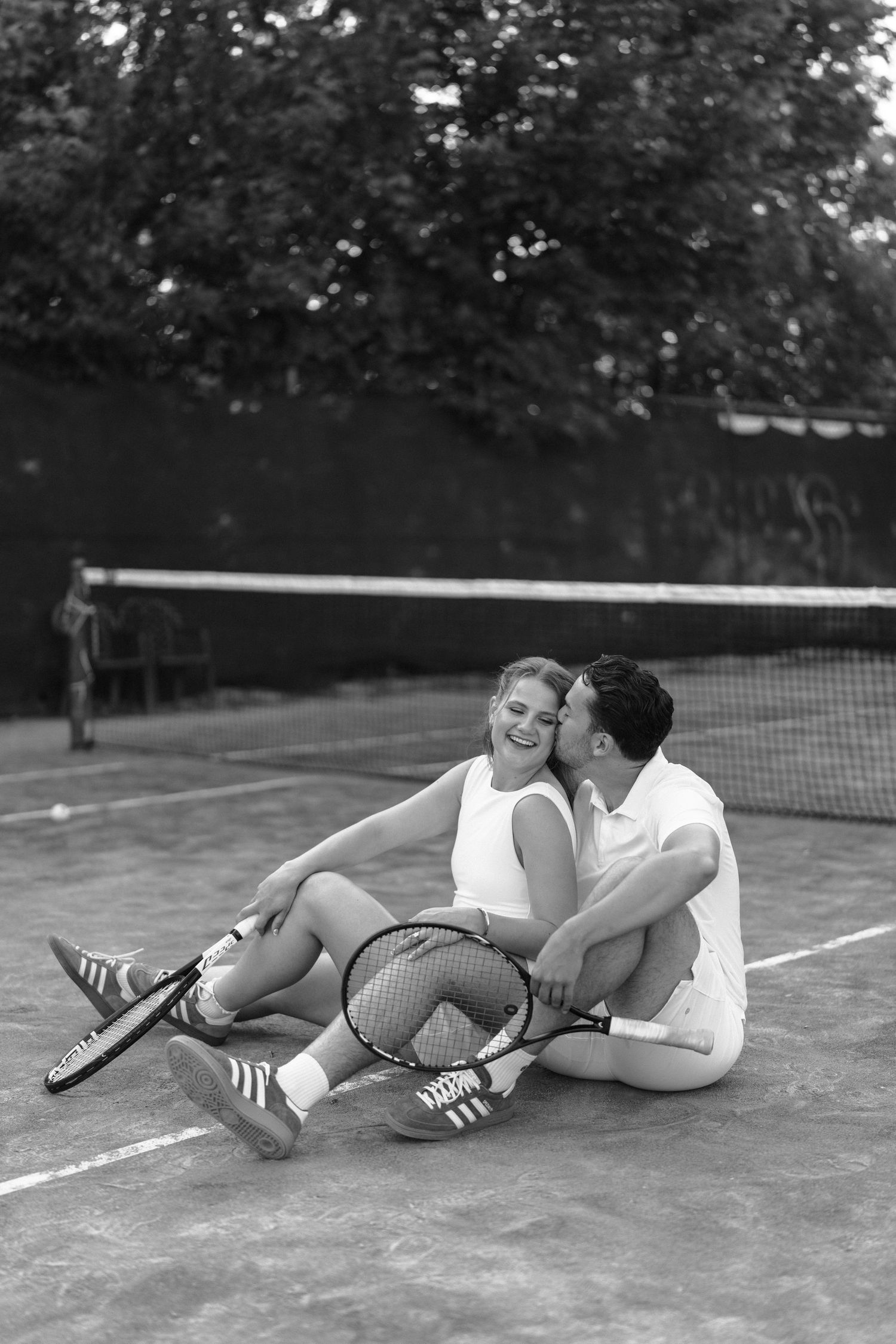 Three vintage photos show a couple falling down while attempting to jump over a tennis net.