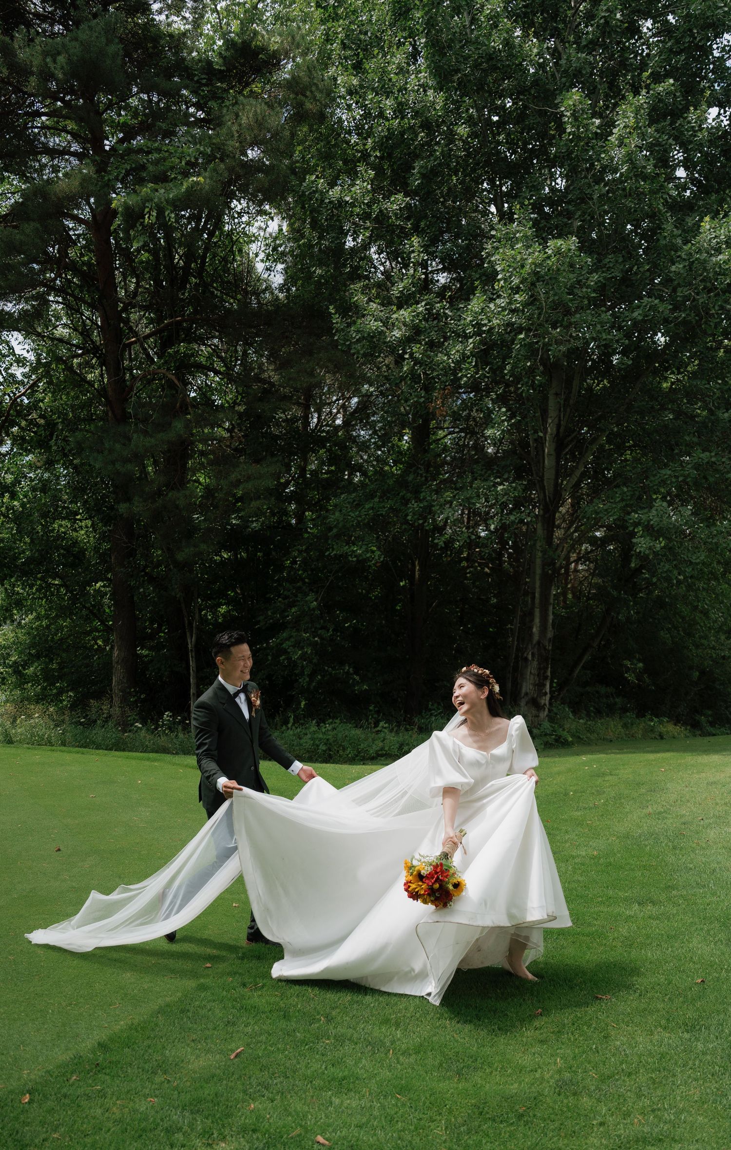Fun moment of bride and groom chasing each other in the middle of Pheasant Run Golf Club, AZ Photo Studio.