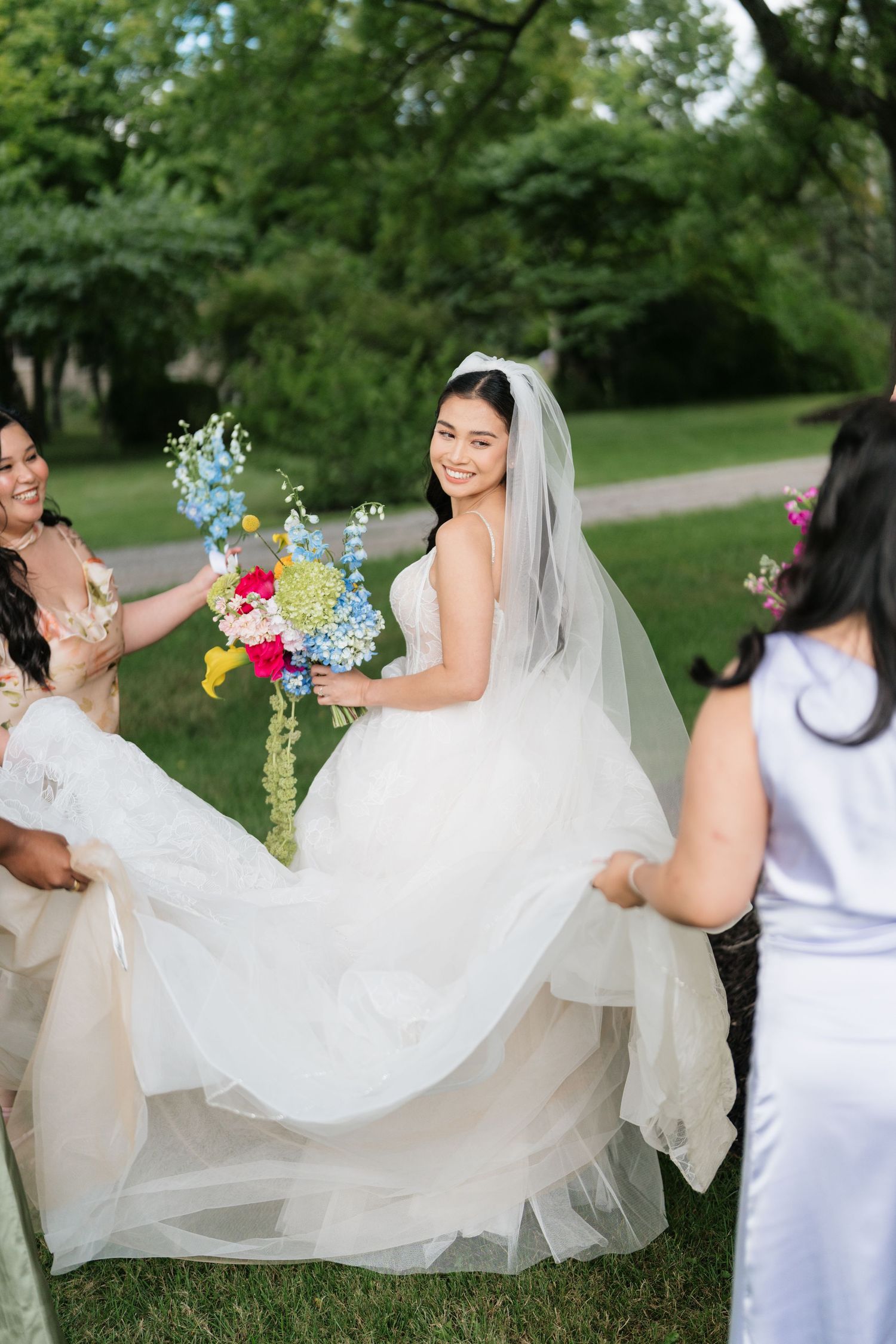A sequence of photos showing a flowing white wedding dress being twirled in an outdoor garden setting.