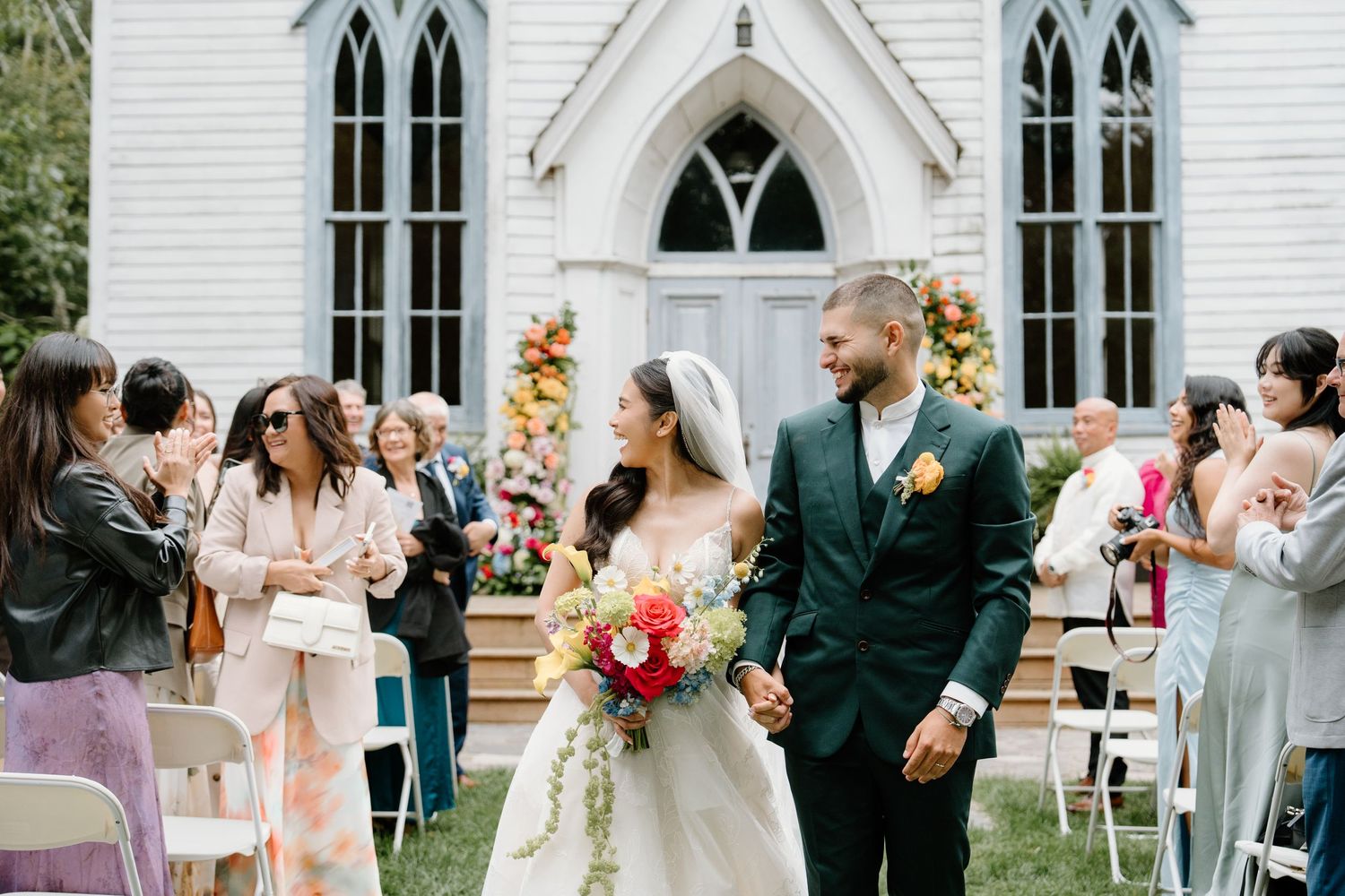A collage of wedding ceremony moments at a white chapel with Gothic windows and floral decorations.