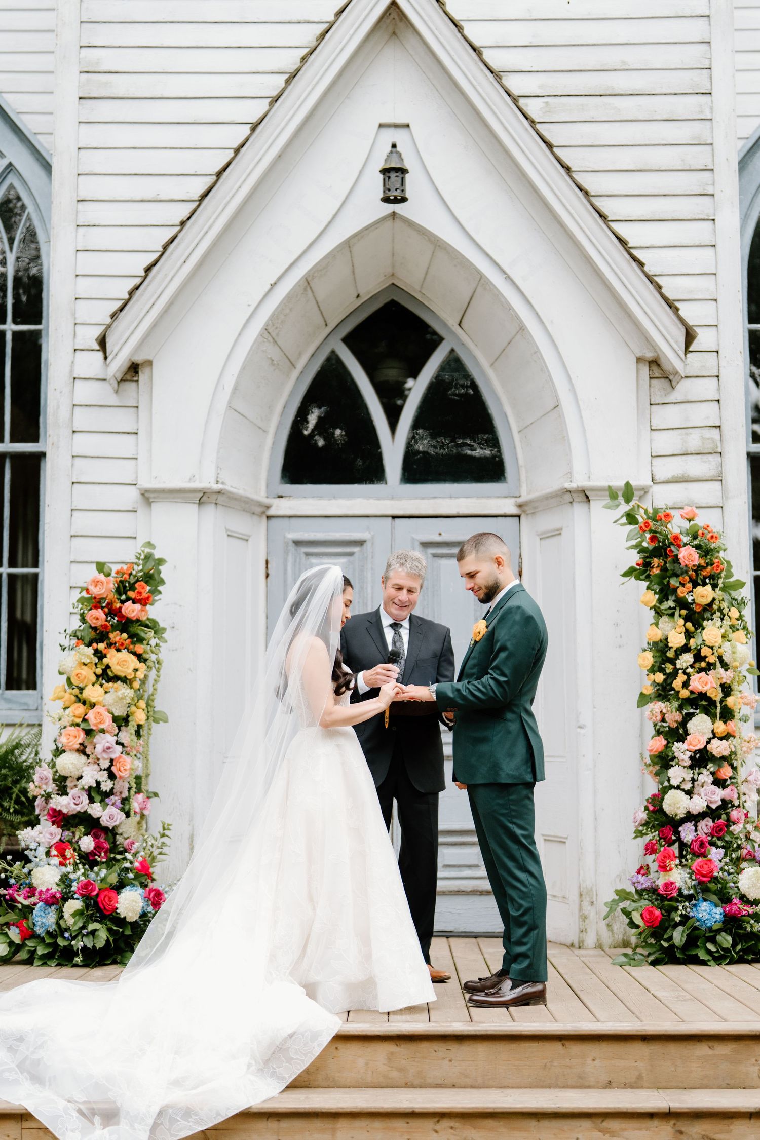 Wedding ceremony moments captured in sequence at a charming white chapel with floral arrangements and gothic arches.