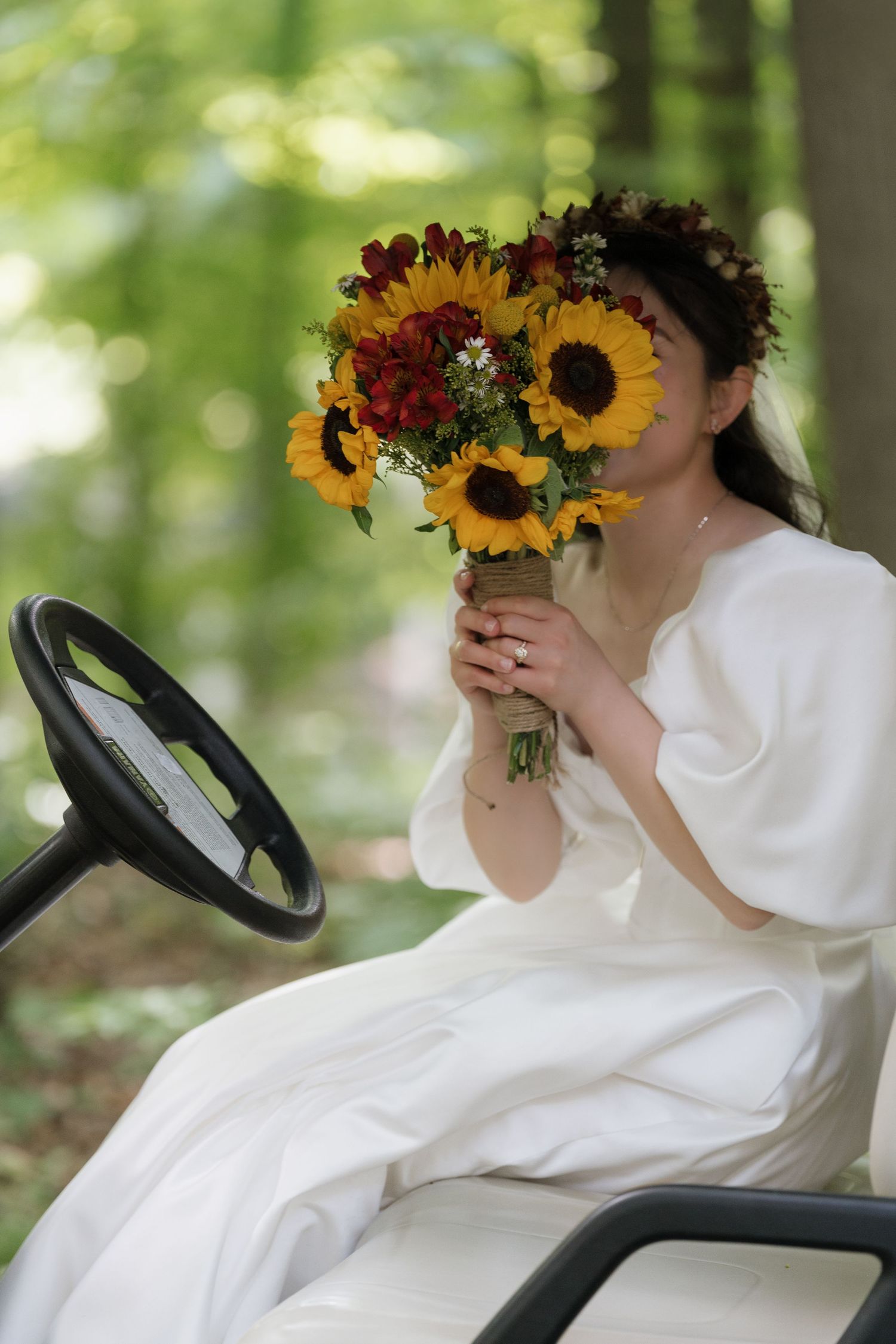 Stunning bride standing amidst lush greenery captured by AZ Photo Studio