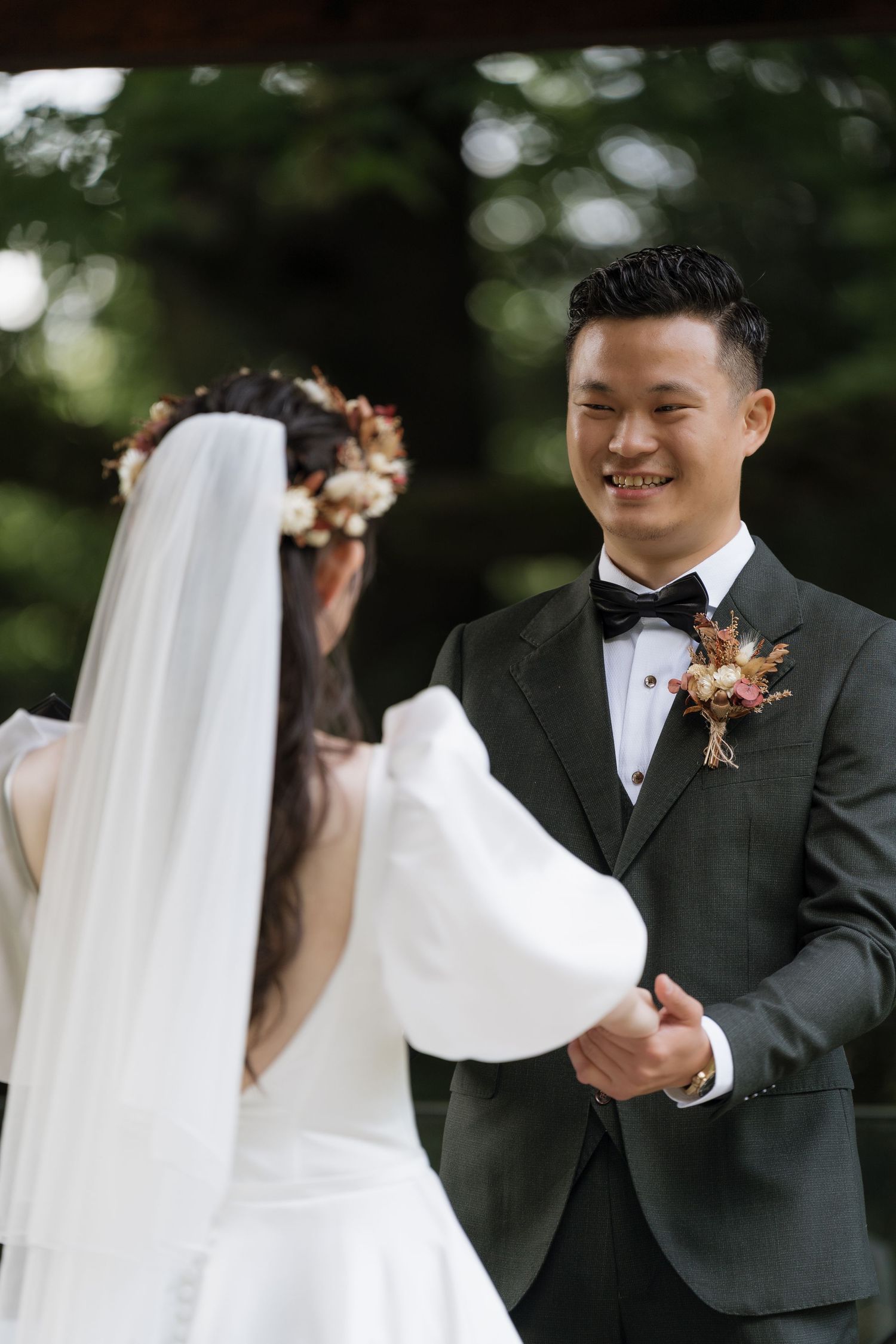Exchanging ring outdoor wedding captured by AZ Photo Studio