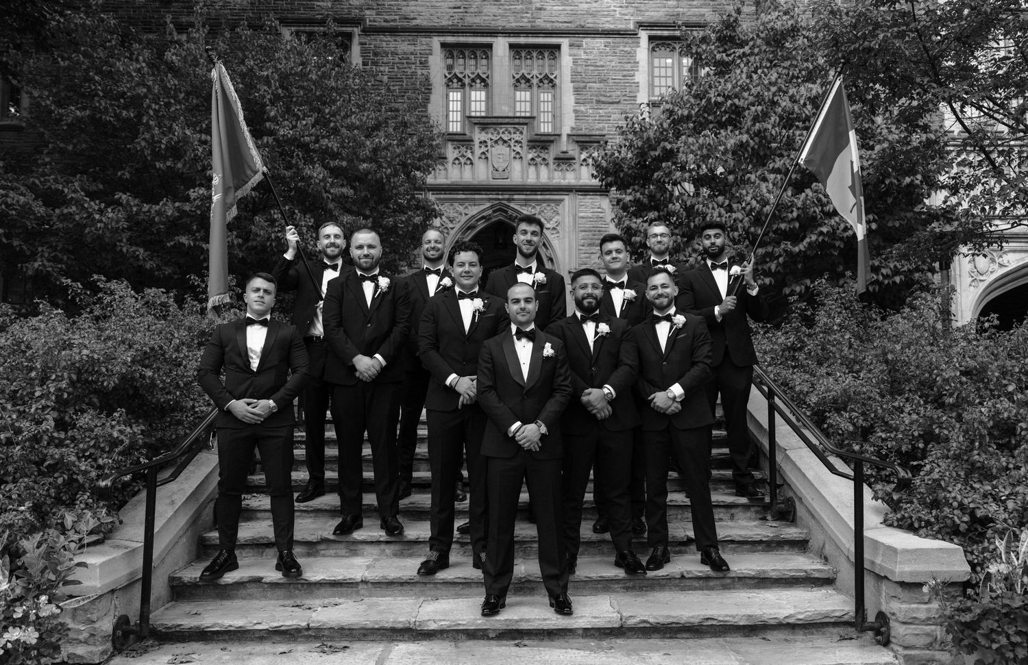 A series of black and white wedding party photos showing groups posed outdoors on stone steps.