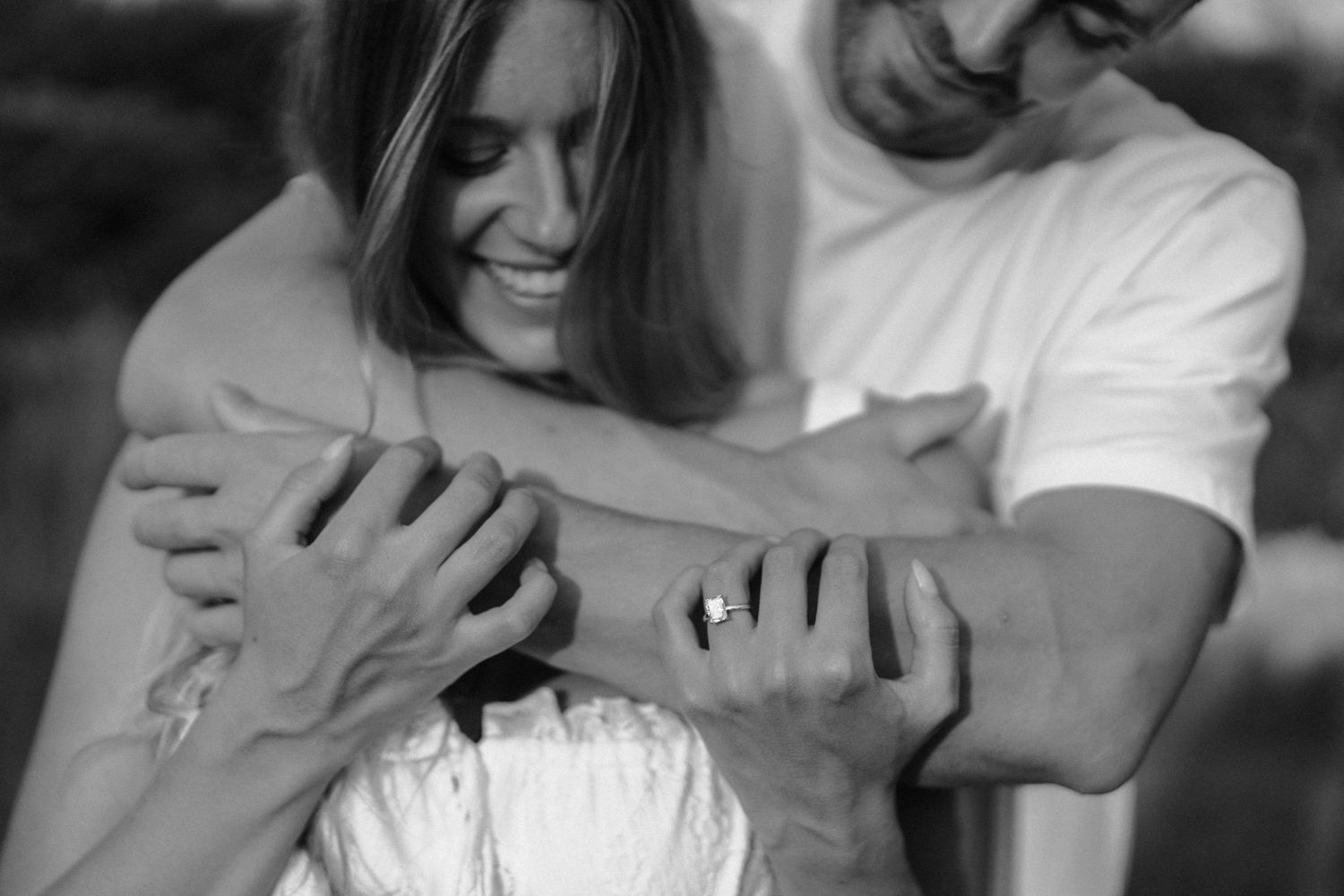 Black and white photo series showing tender moments between two people in a candid documentary style in Toronto by AZ Photo Studio