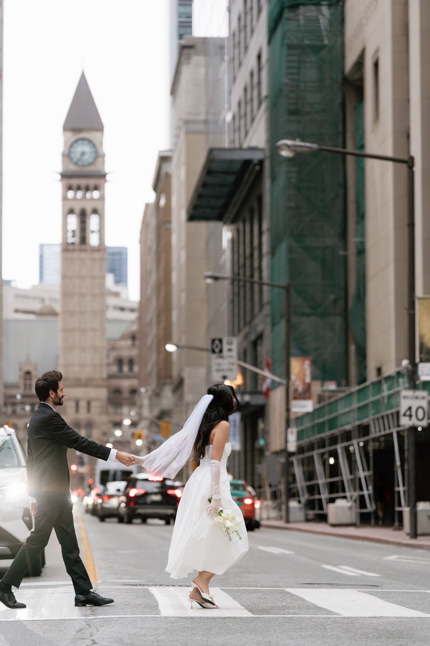 Documentary-style candid street photoshoot in Toronto with City Hall in background by AZ Photo Studio