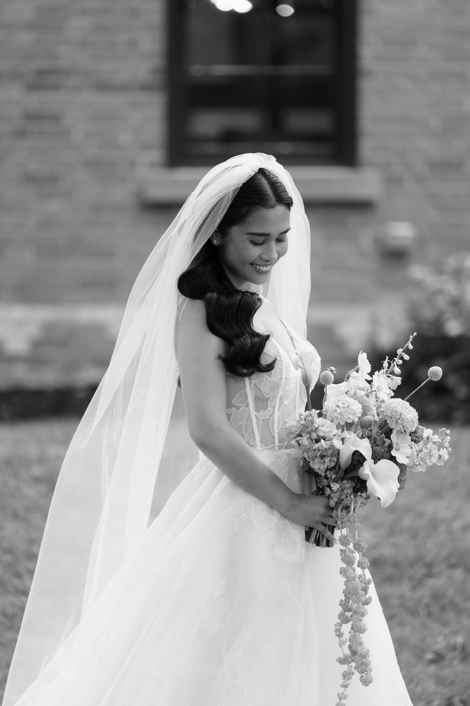 Black and white series showing elegant bridal details with flowing veil and white floral bouquet.