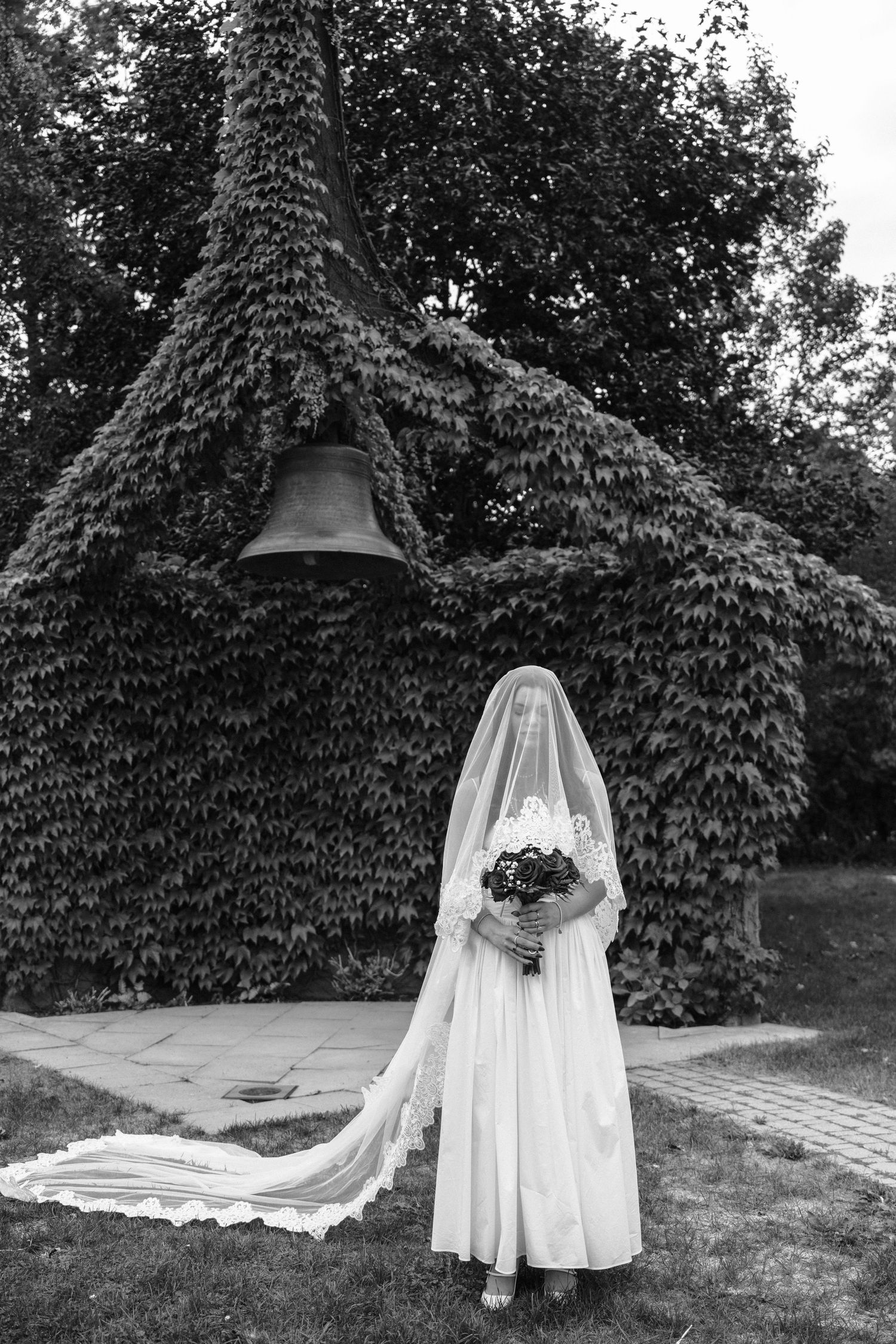 A sequence of artistic black and white wedding photos taken against a backdrop of ivy-covered walls outdoors.