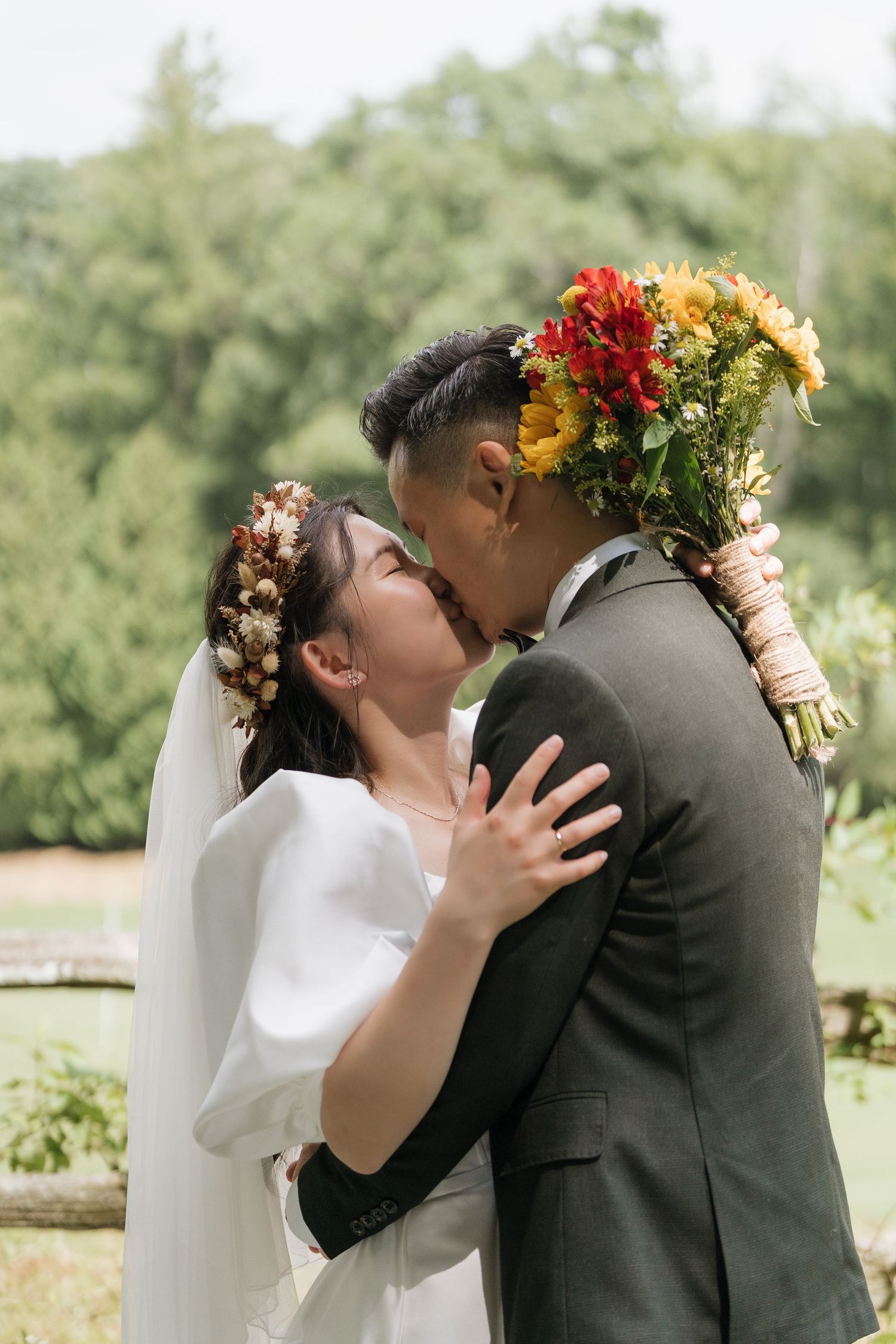 Stunning natural light couple's portrait in an open field captured by AZ Photo Studio