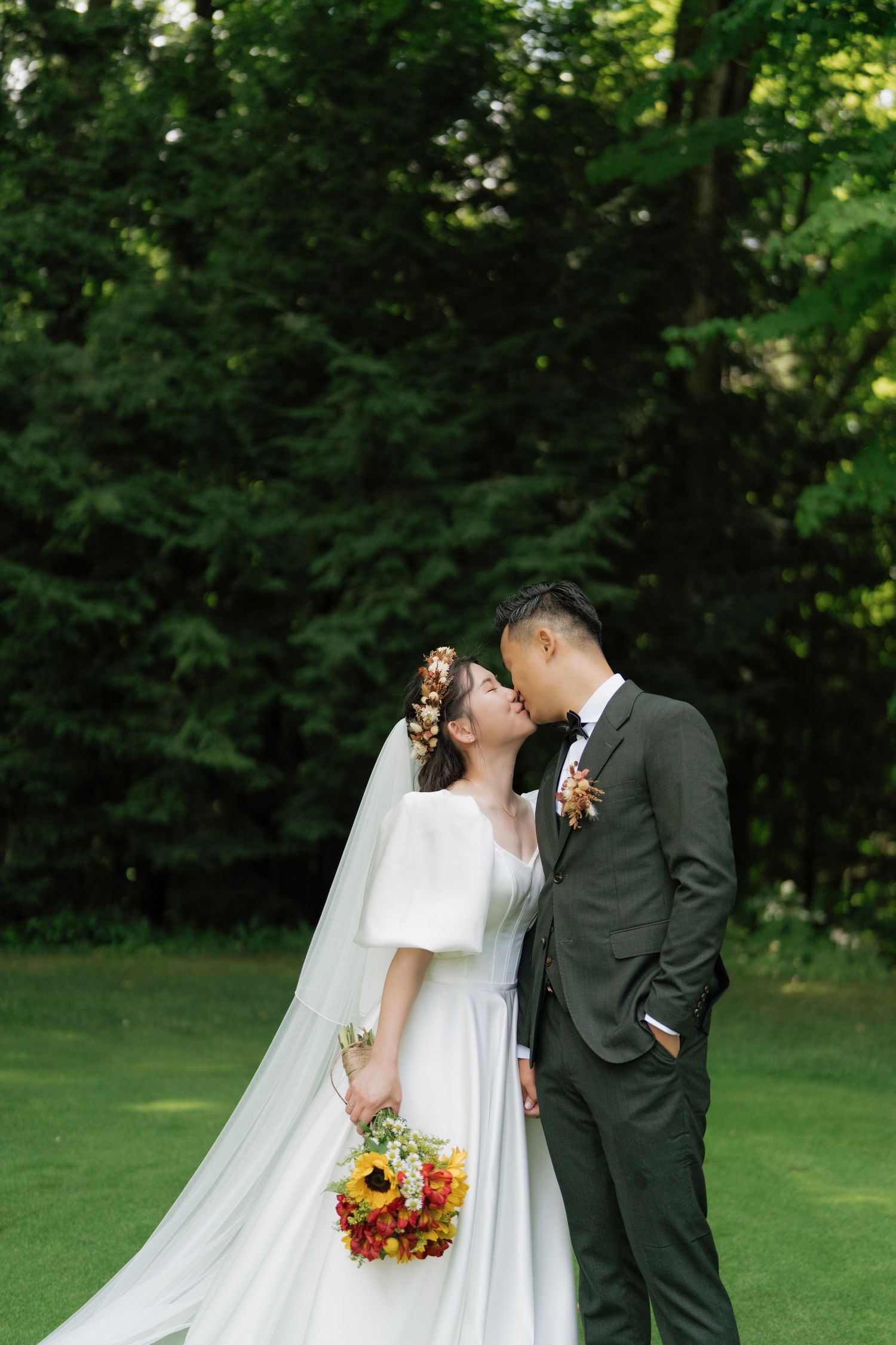 Intimate wedding photography amidst green landscapes captured by AZ Photo Studio