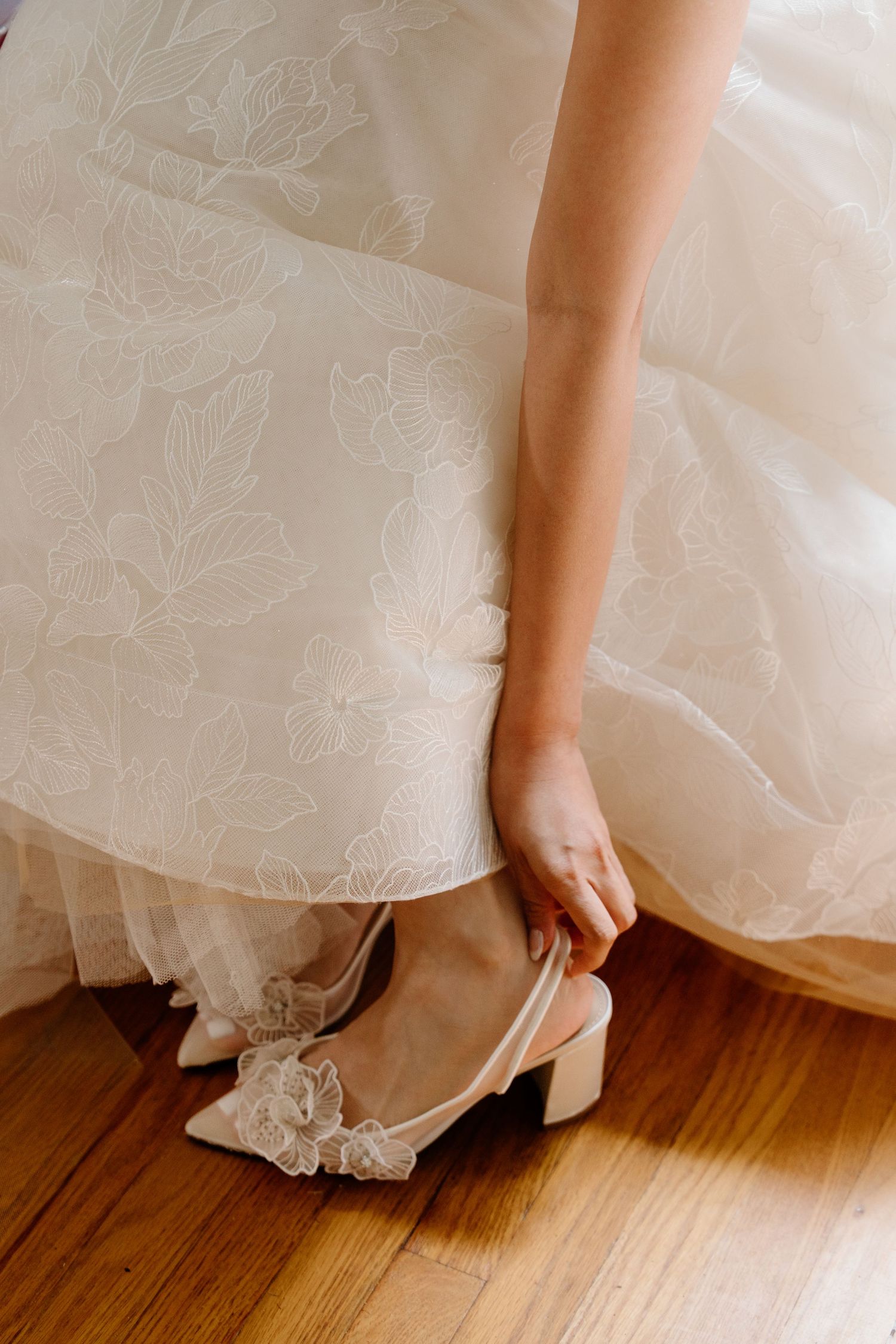 A series of photos showing elegant white wedding shoes peeking out beneath the hem of a flowing bridal gown.