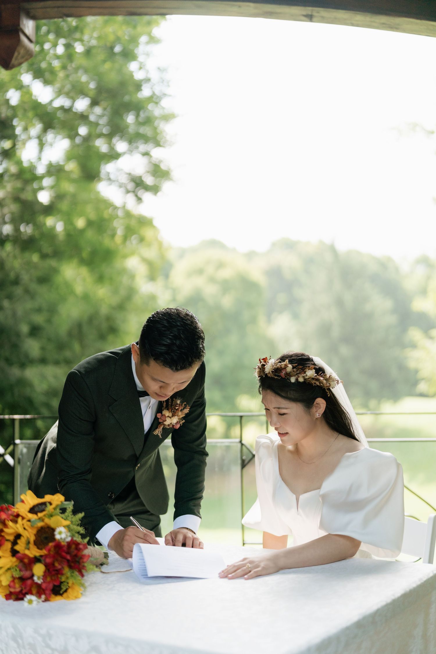 Signing the marriage certificate outdoor wedding captured by AZ Photo Studio