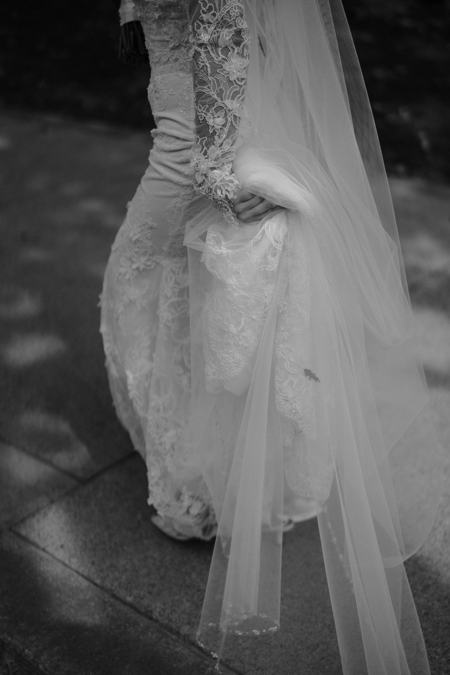 A black and white photo series showing the flowing layers and delicate details of a wedding dress and veil.