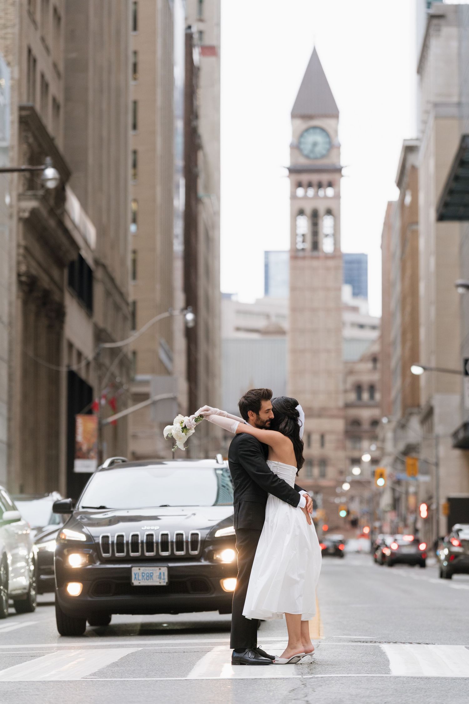Storytelling through candid street style photography in Toronto old city hall Clock Tower captured by  AZ Photo Studio