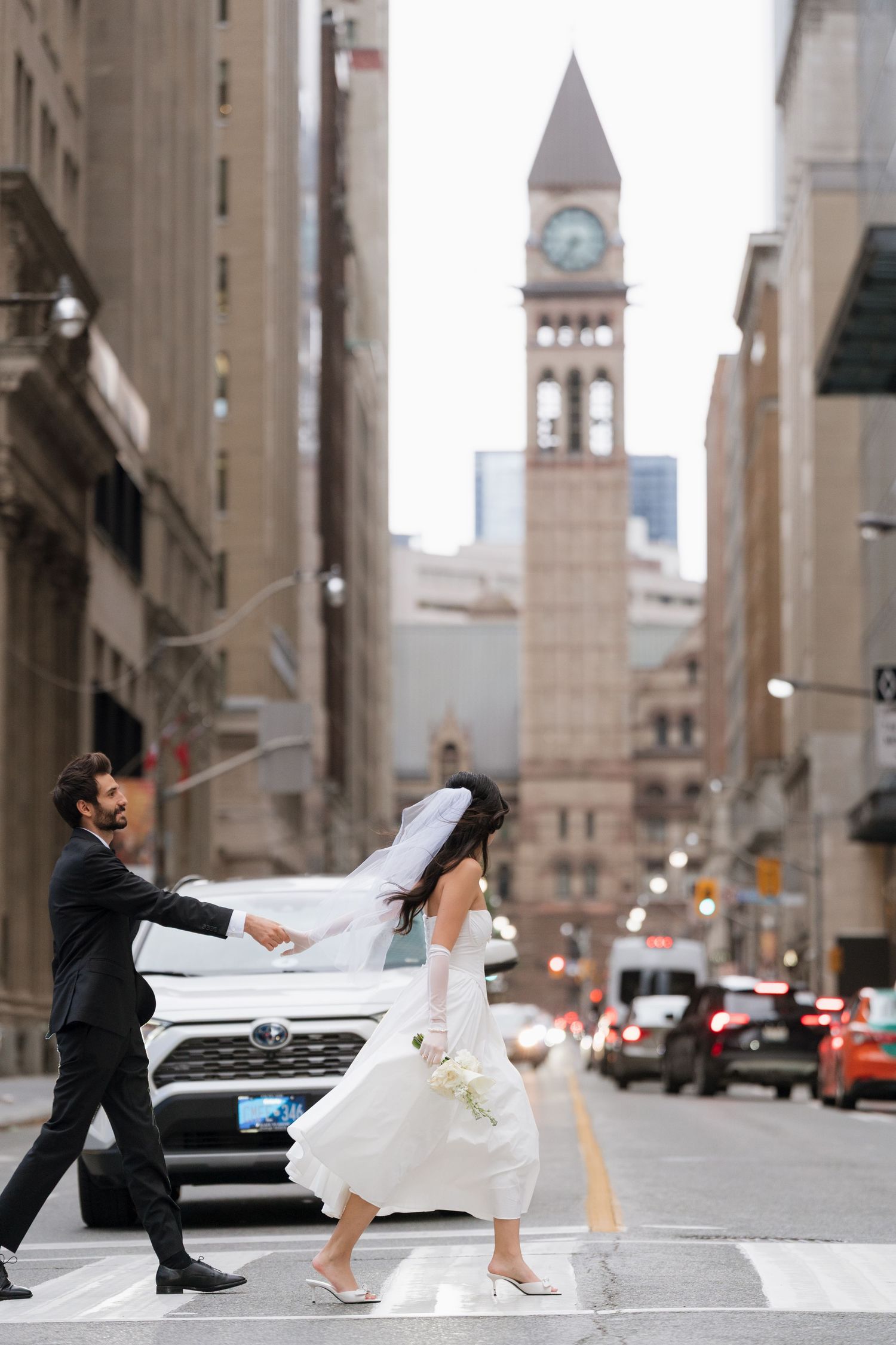 Storytelling through candid street style photography in Toronto old city hall Clock Tower captured by  AZ Photo Studio