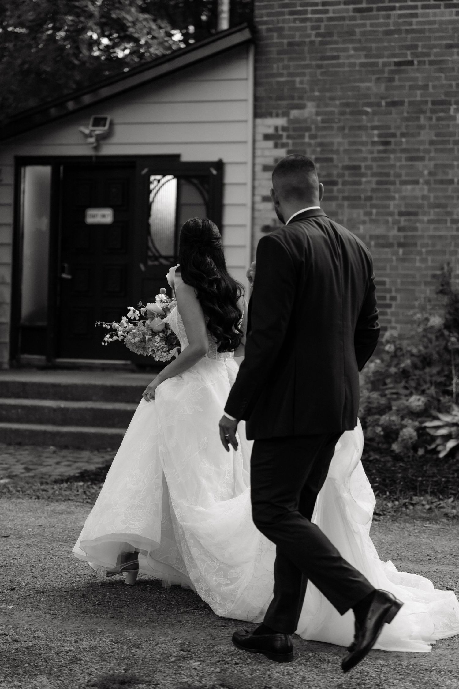 A series of black and white photos showing a couple walking together in formal wedding attire.