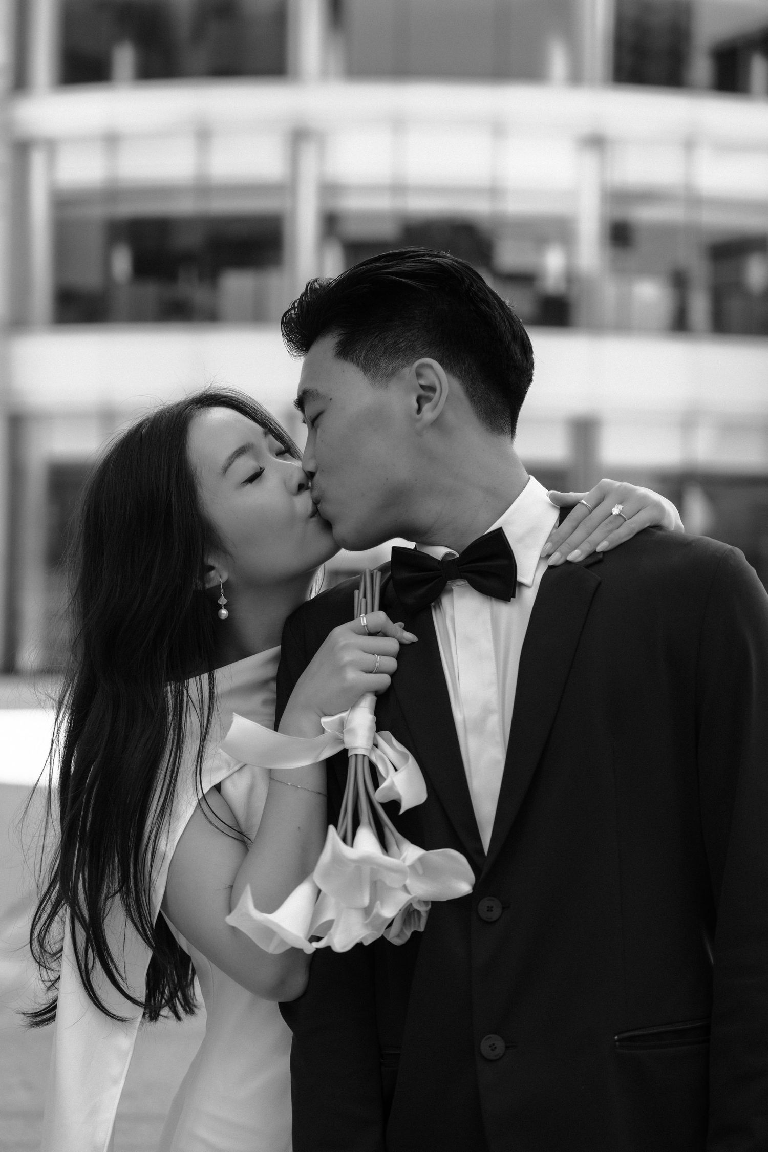 A black and white sequence showing a romantic kiss unfolding in multiple frames.