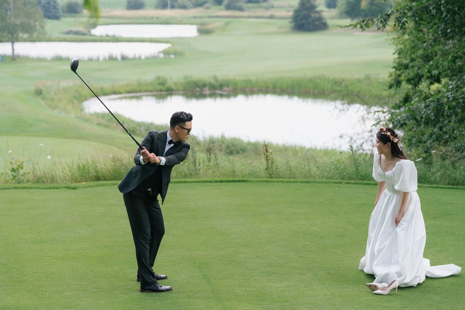 Couple's joyful moments under the clear blue sky captured by AZ Photo Studio