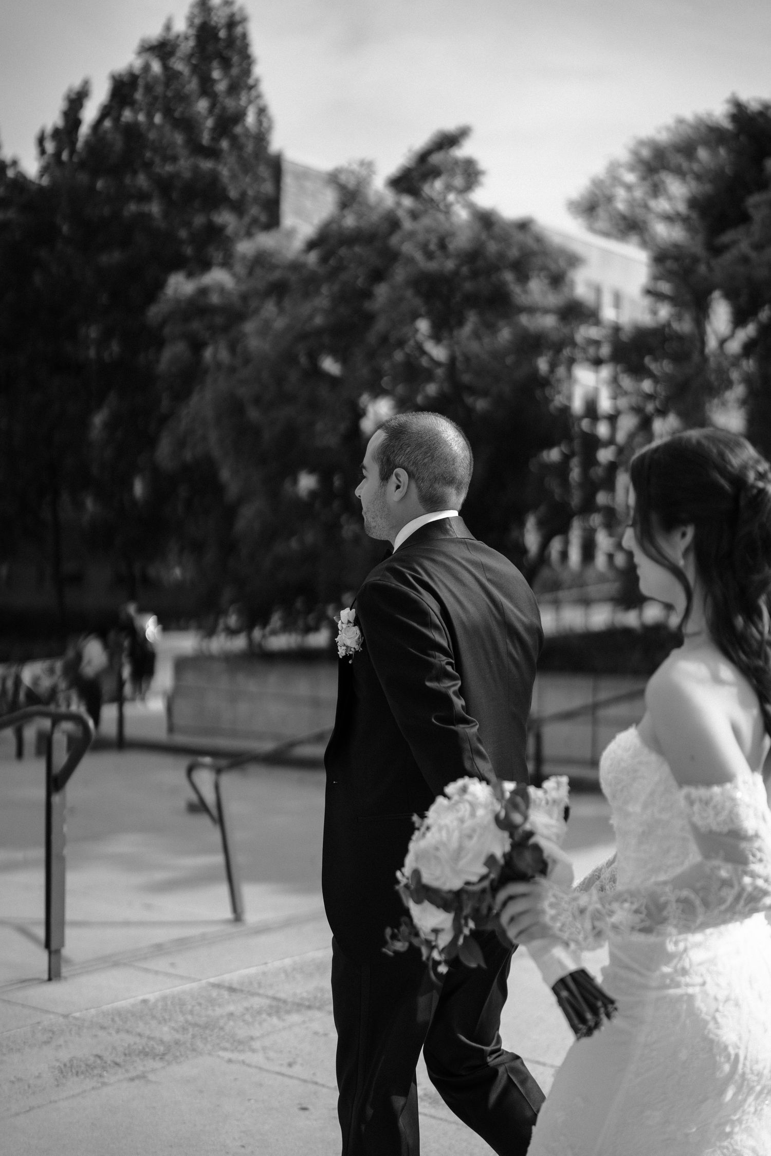 A romantic black and white wedding photo sequence shows a couple walking and embracing in a park setting.