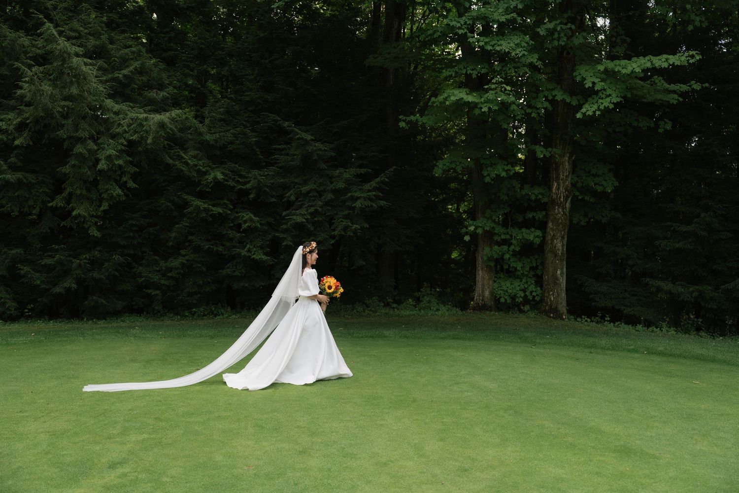Stunning and Beautiful bride with a flowing veil in the wind captured by AZ Photo Studio