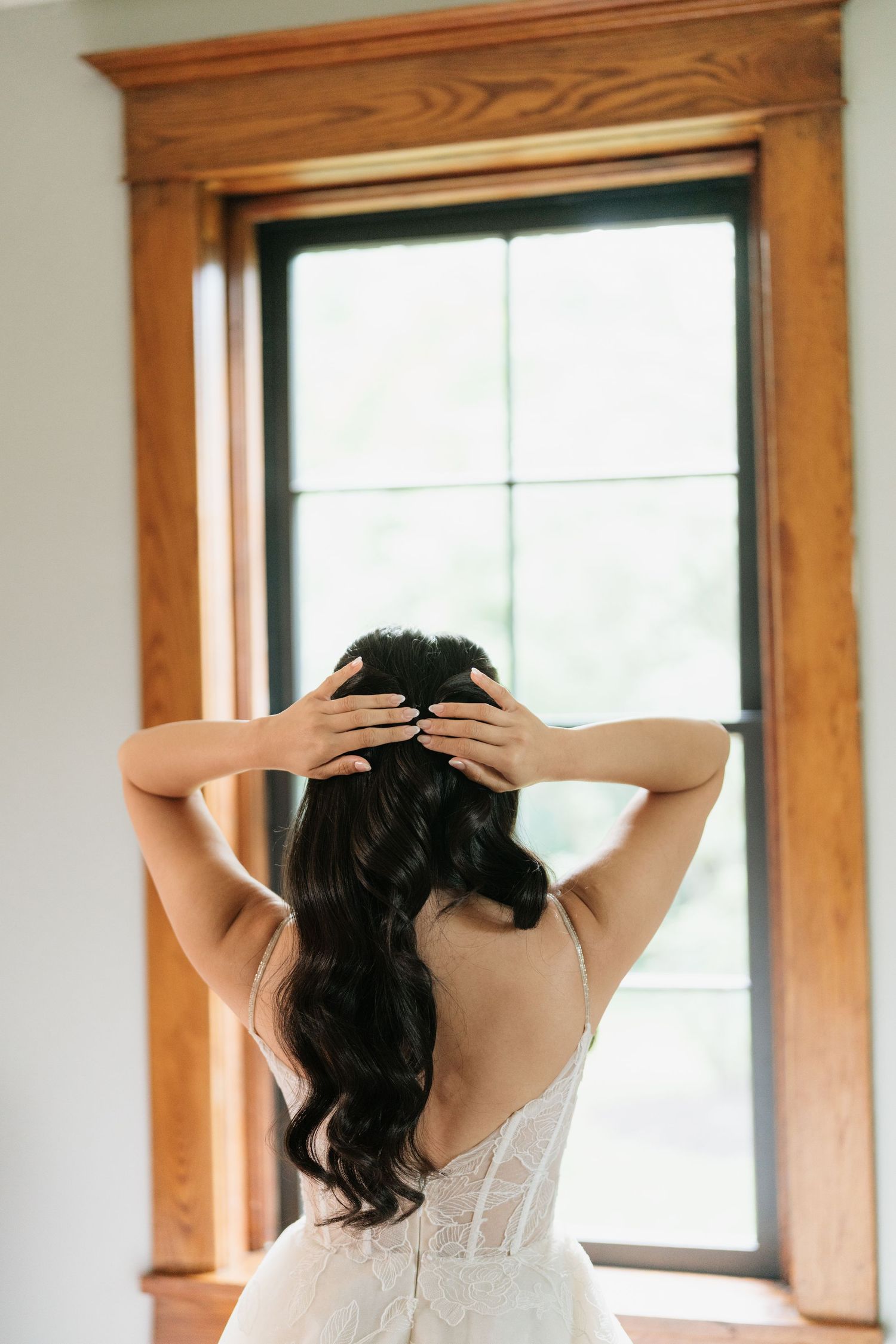 Three artistic photos of a person with dark hair seen from behind against wooden-framed windows in natural light.