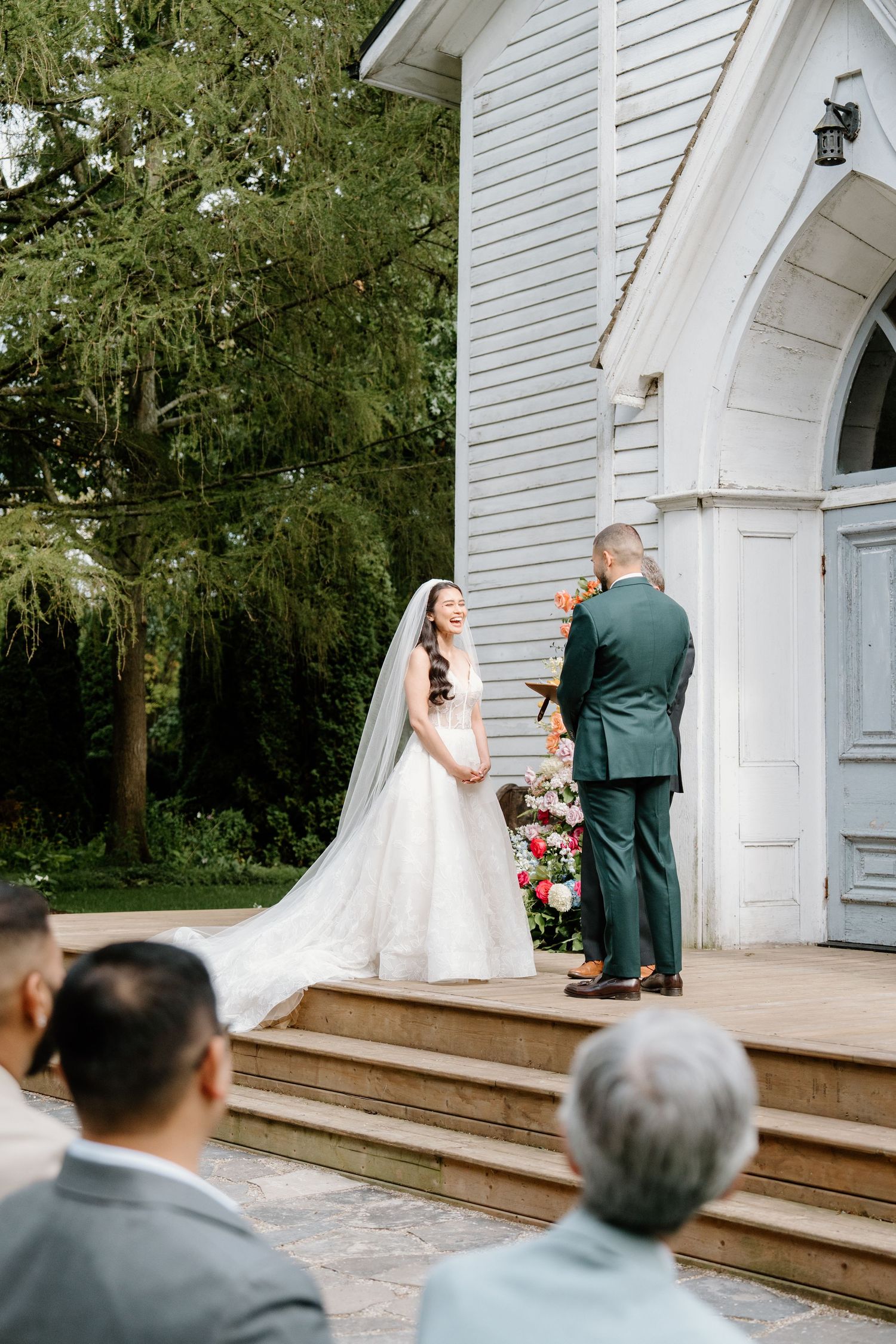 A wedding ceremony sequence showing a couple exchanging vows on the steps of a white church building.