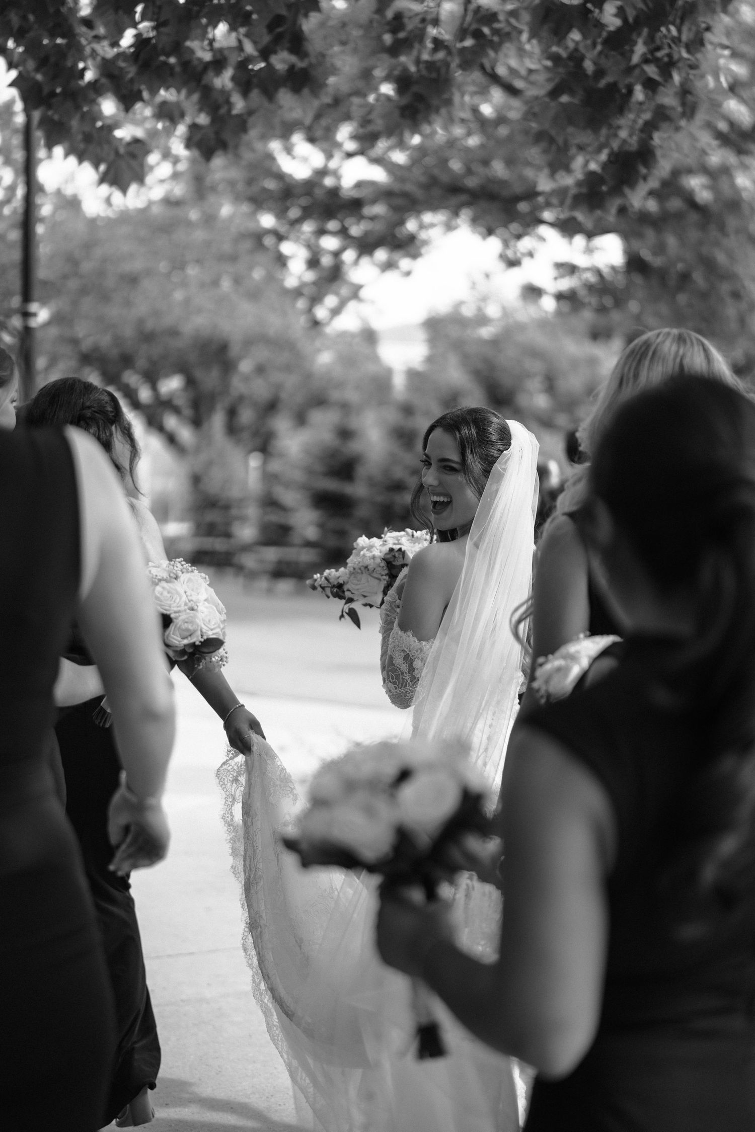 A sequence of black and white wedding photos showing a bride and guests in an outdoor garden setting.