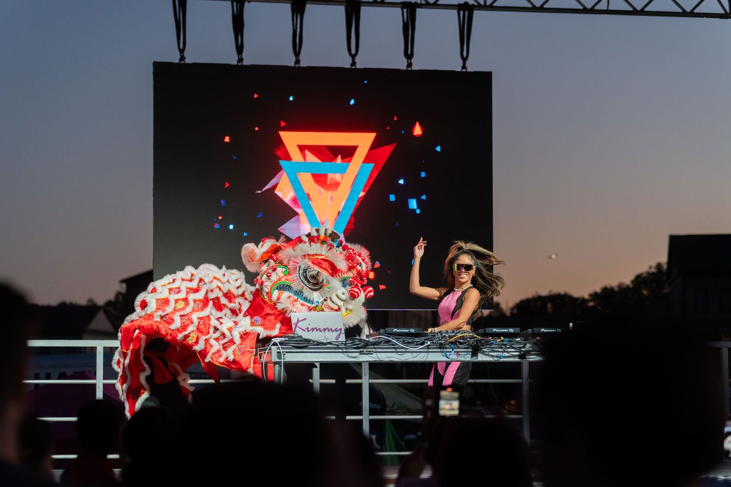 DJ perform on stage with lion dancers at the 2024 Asian Fest held at Leesburg, VA. Photo by Wornden Ly for Hi-Ball Events