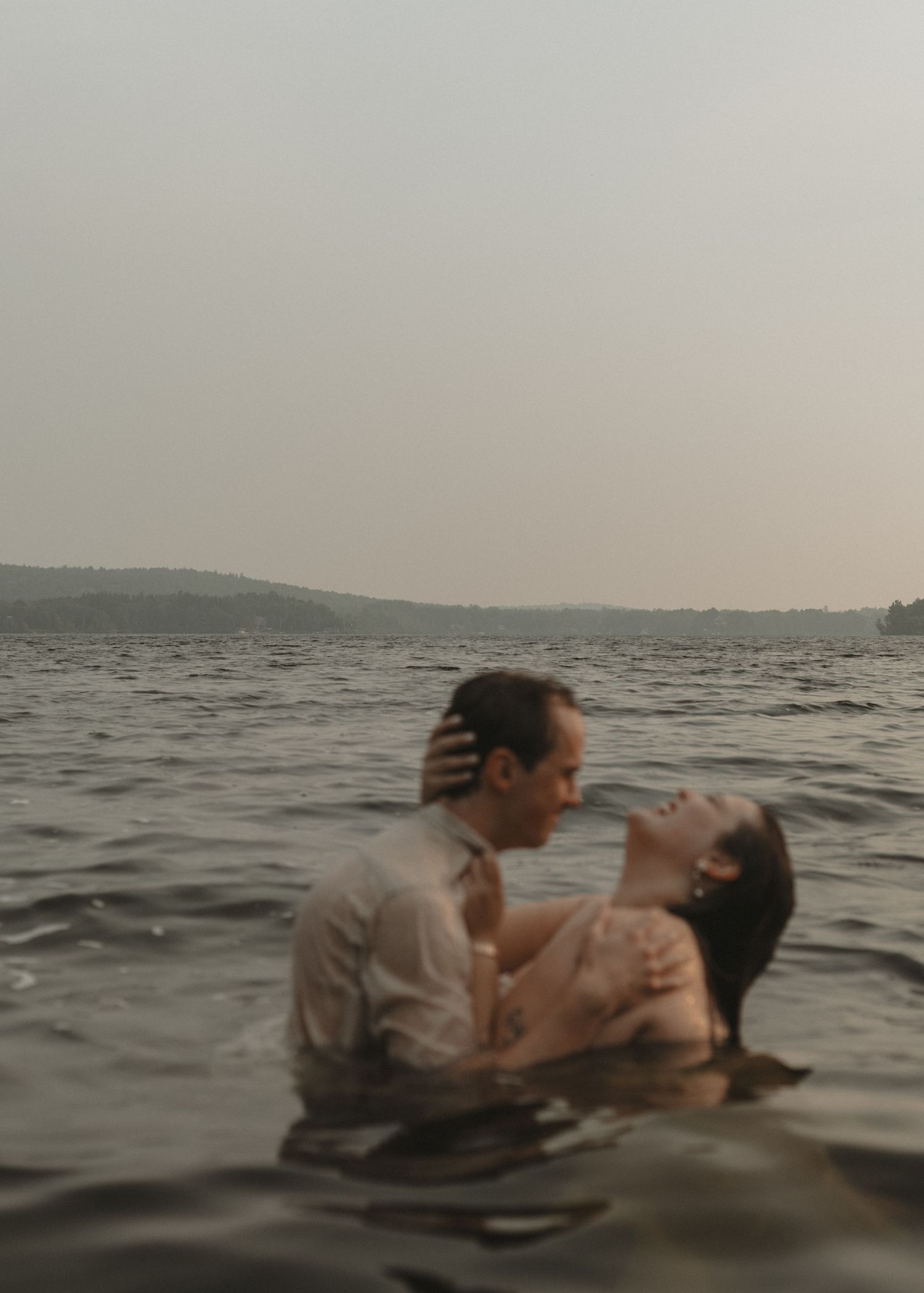 Local Sudbury Ontario Photographer captures water filled engagement photoshoot at Kalmo Beach in Val Caron