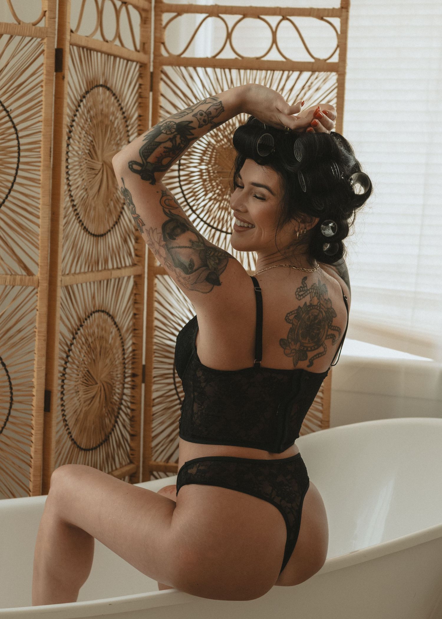 local Sudbury Boudoir expert provides boudoir photoshoot experience in black lingerie in studio