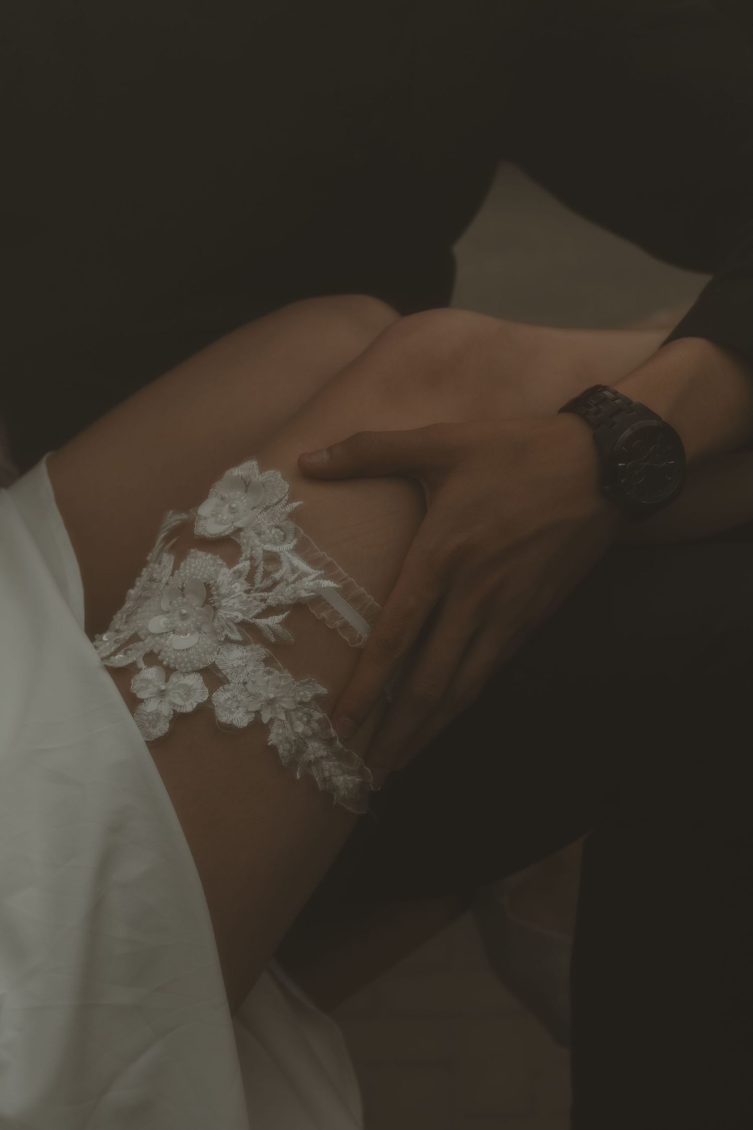 local Sudbury Boudoir expert provides boudoir photoshoot experience in white lingerie in studio